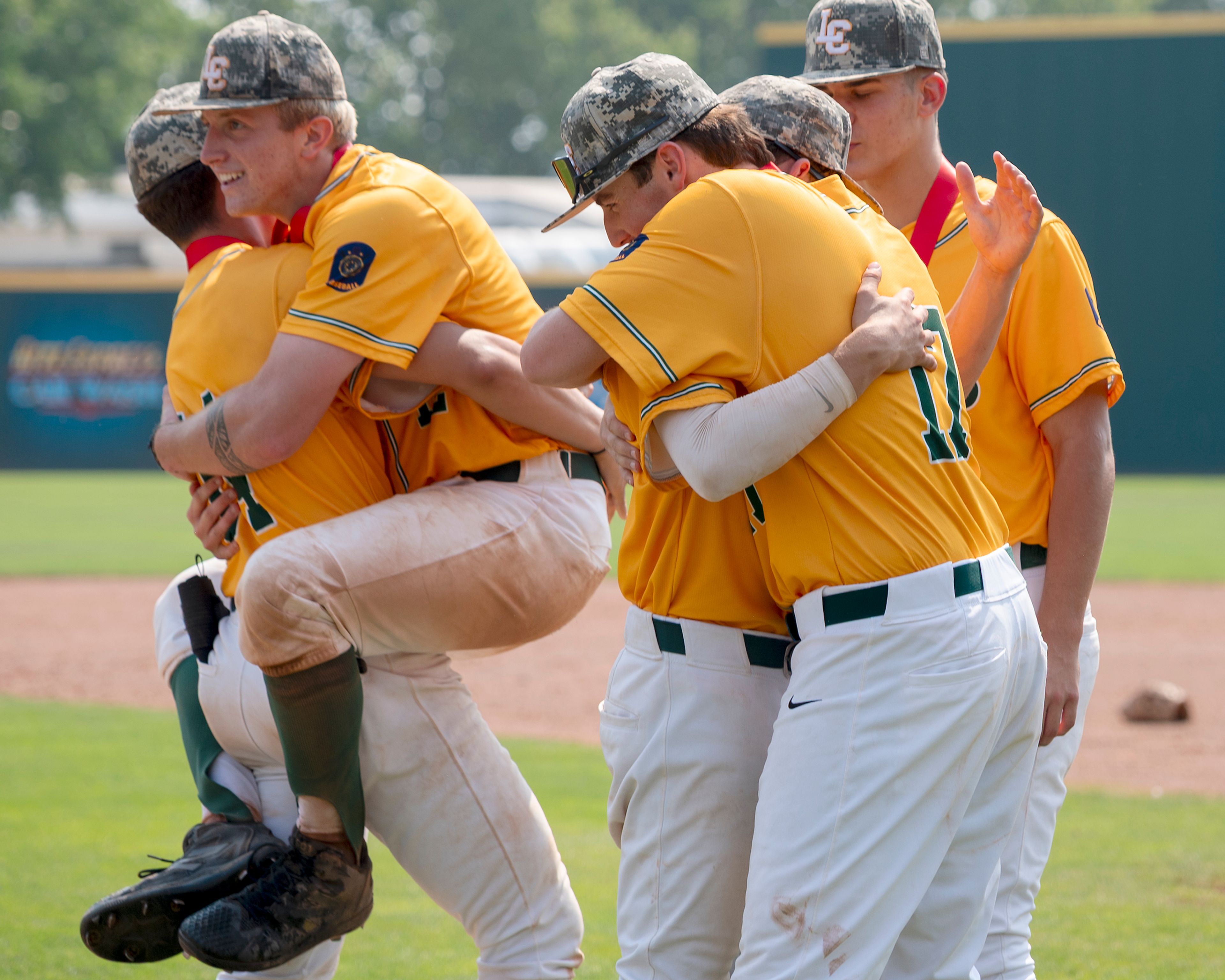 The Twins celebrate winning the championship game between the Lewis-Clark Twins and the Idaho Falls Bandits in the Idaho AA American Legion baseball state tournament on July 27 at Harris Field in Lewiston.