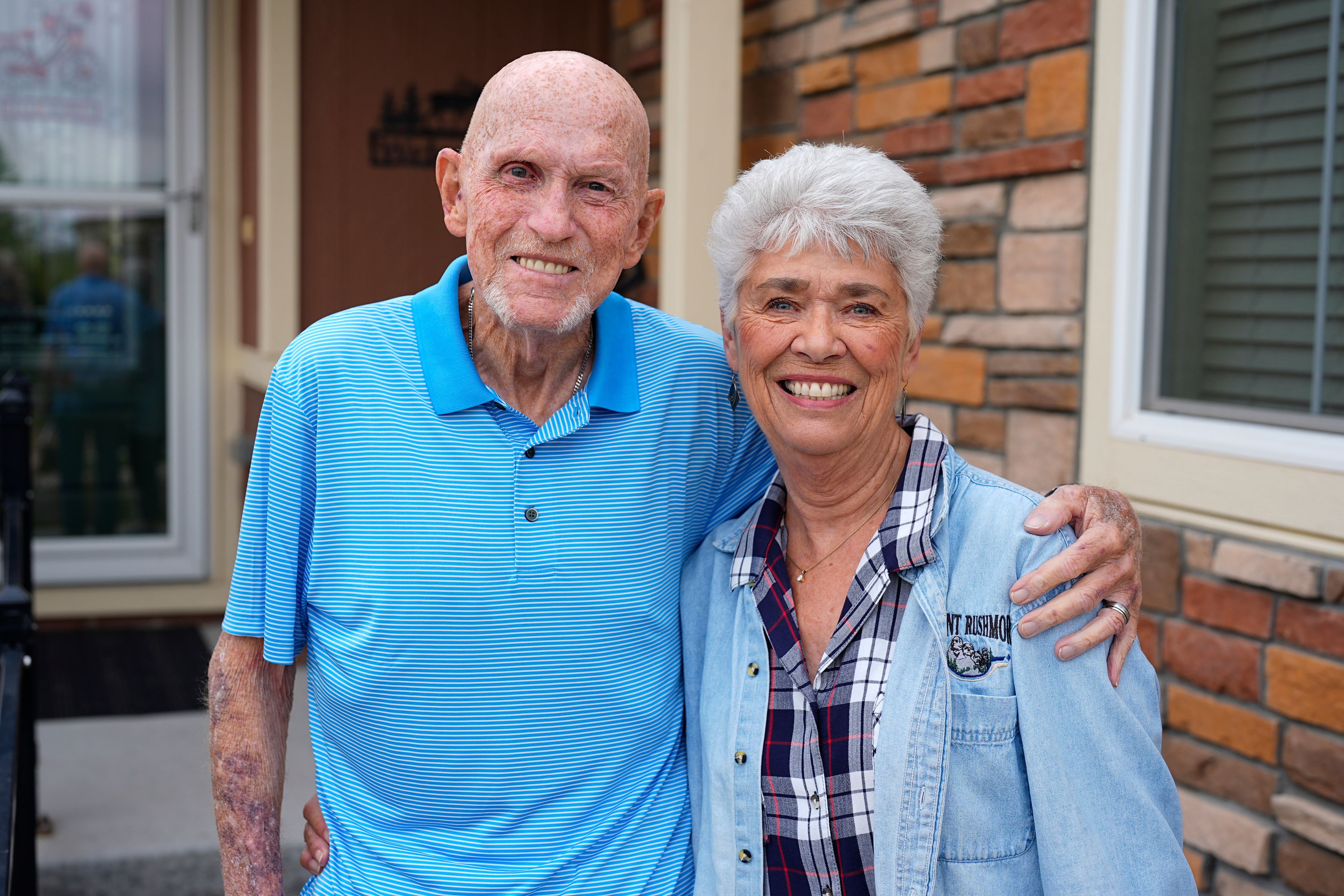 Tom McAdam and his wife, Beverly, stand outside their home Friday, May 31, 2024, in Broomfield, Colo. The retired couple's home in the northwest Denver suburb has risen 45 percent in value since purchasing six years ago that has increased their property tax. The couple is backing a Colorado ballot proposal that could cap the growth of property tax revenue, one of several measures in states this year to limit, cut or offset escalating property taxes in response to the complaints of residents.