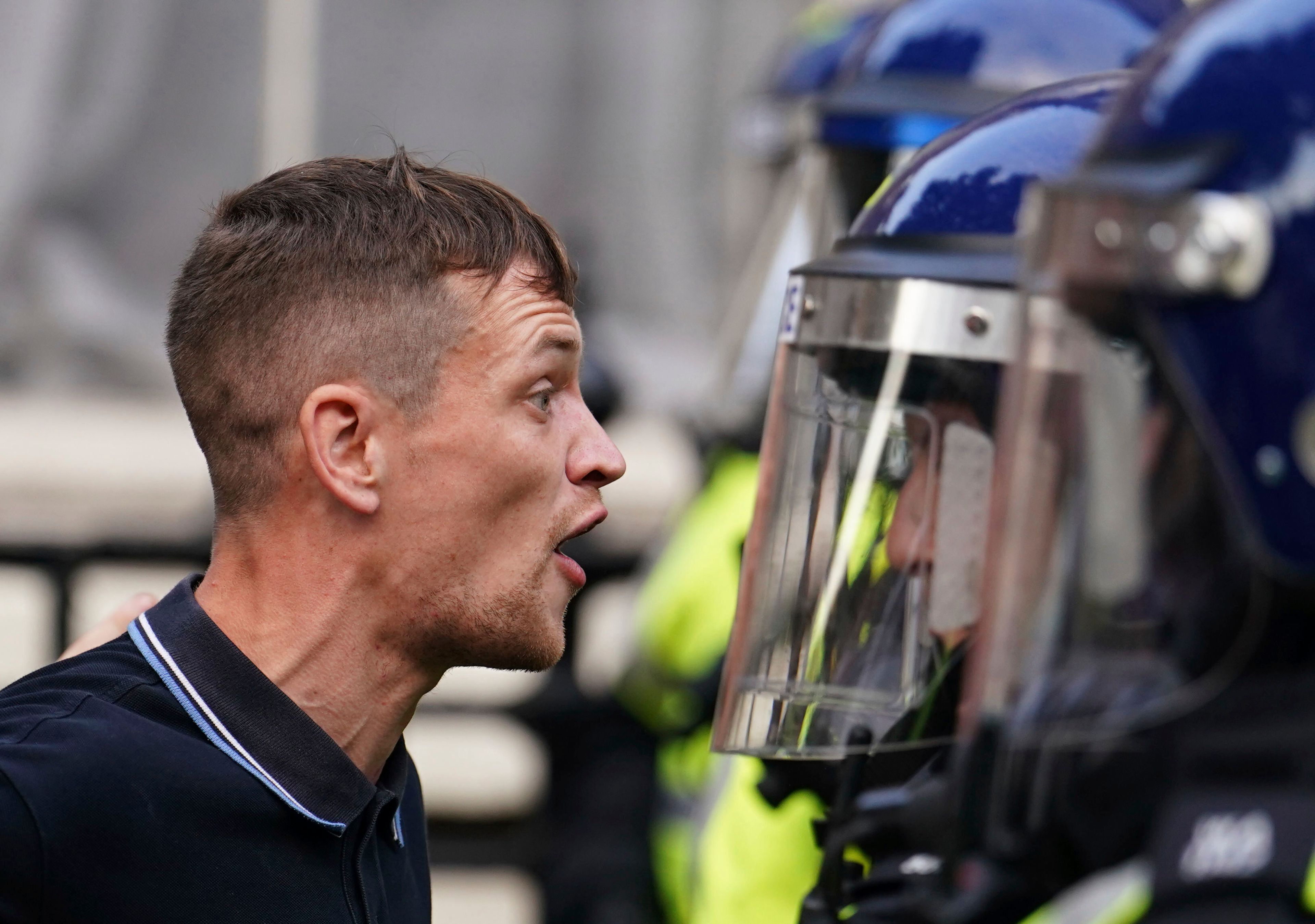 Protesters confront police during the "Enough is Enough" protest in Whitehall, London, Wednesday July 31, 2024, following the fatal stabbing of three children at a Taylor Swift-themed summer holiday dance and yoga class on Monday in Southport. (Jordan Pettitt/PA via AP)