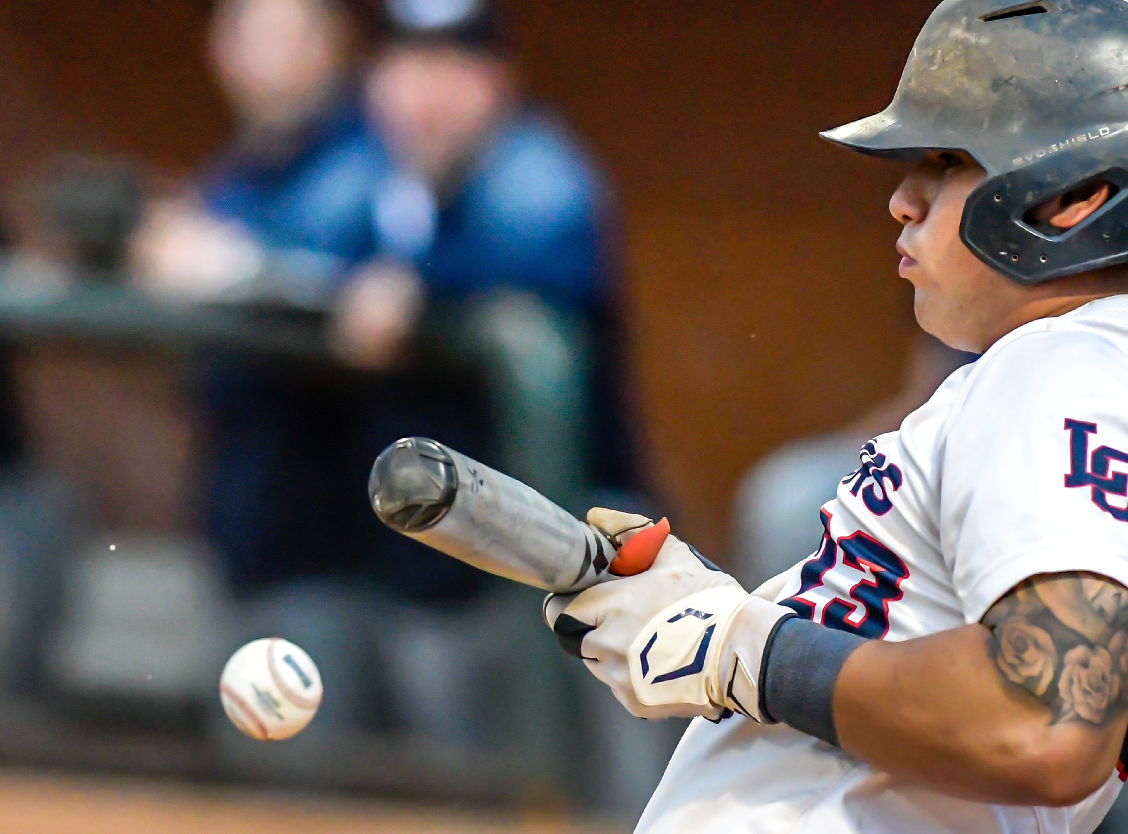 Lewis-Clark State’s Jakob Marquez bunts the ball againast UBC in an inning of a first round game of the NAIA Opening Round Monday at Harris Field in Lewiston.