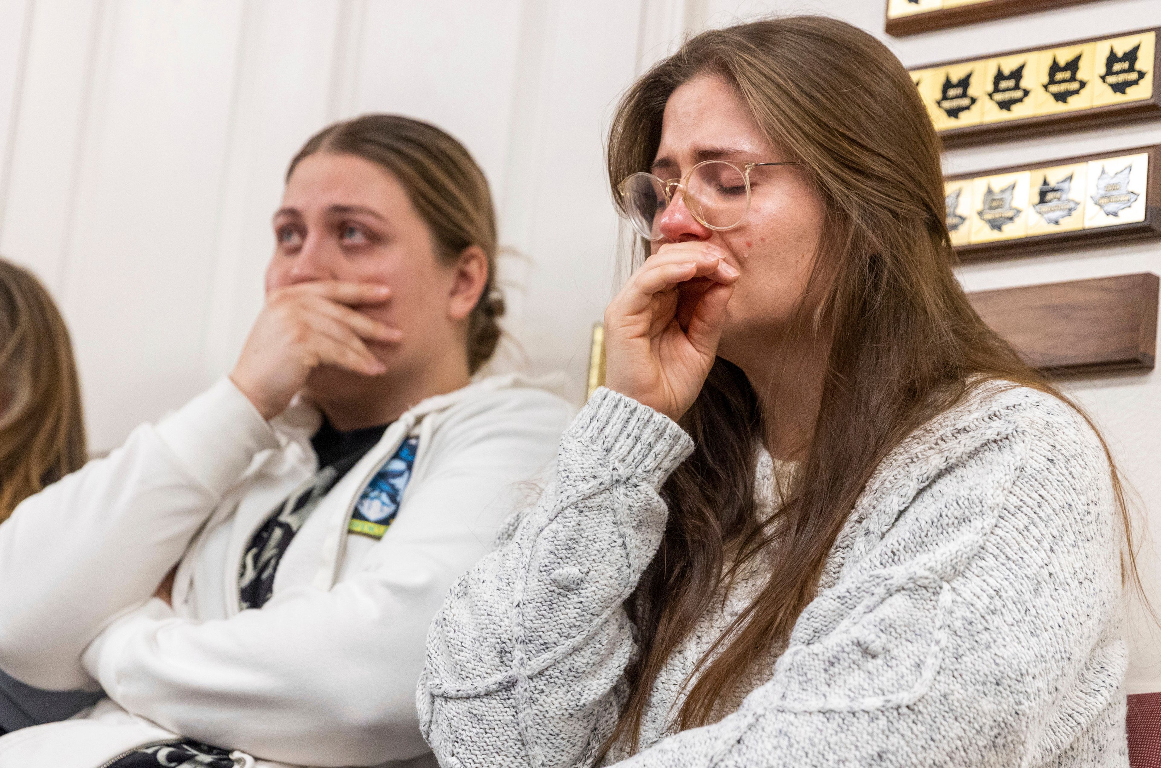 Two sisters react during a news conference Thursday about the killing of a family in Enoch, Utah, last week. A man fatally shot his five children, his mother-in-law and his wife, then killed himself two weeks after the woman had filed for divorce, according to authorities and public records.