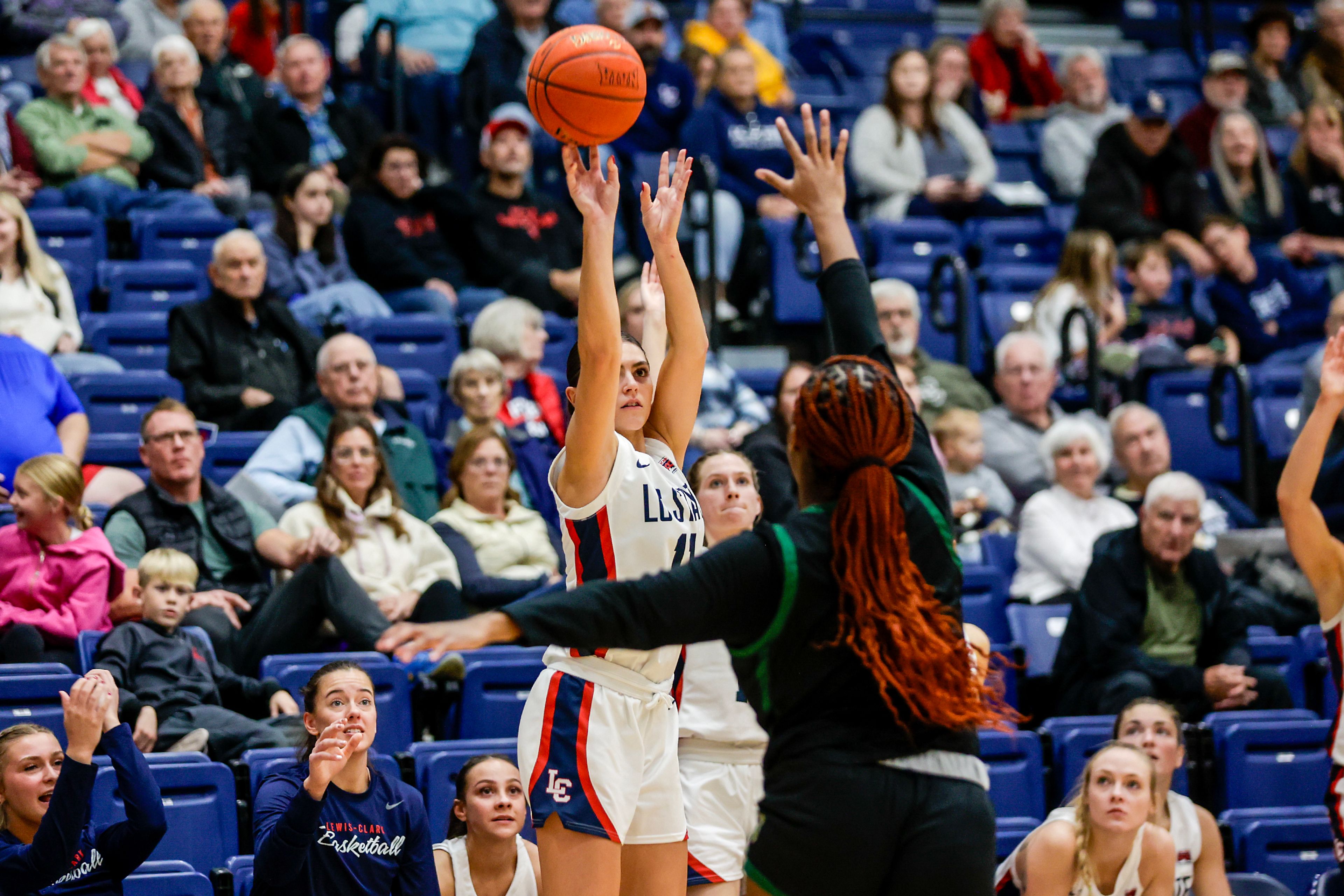 Lewis-Clark State guard Tatum Brager shoots a three-pointer over Walla Walla forward Jordan Green-Wallace during a quarter of a Cascade Conference game Tuesday at Lewis-Clark State College in Lewiston.