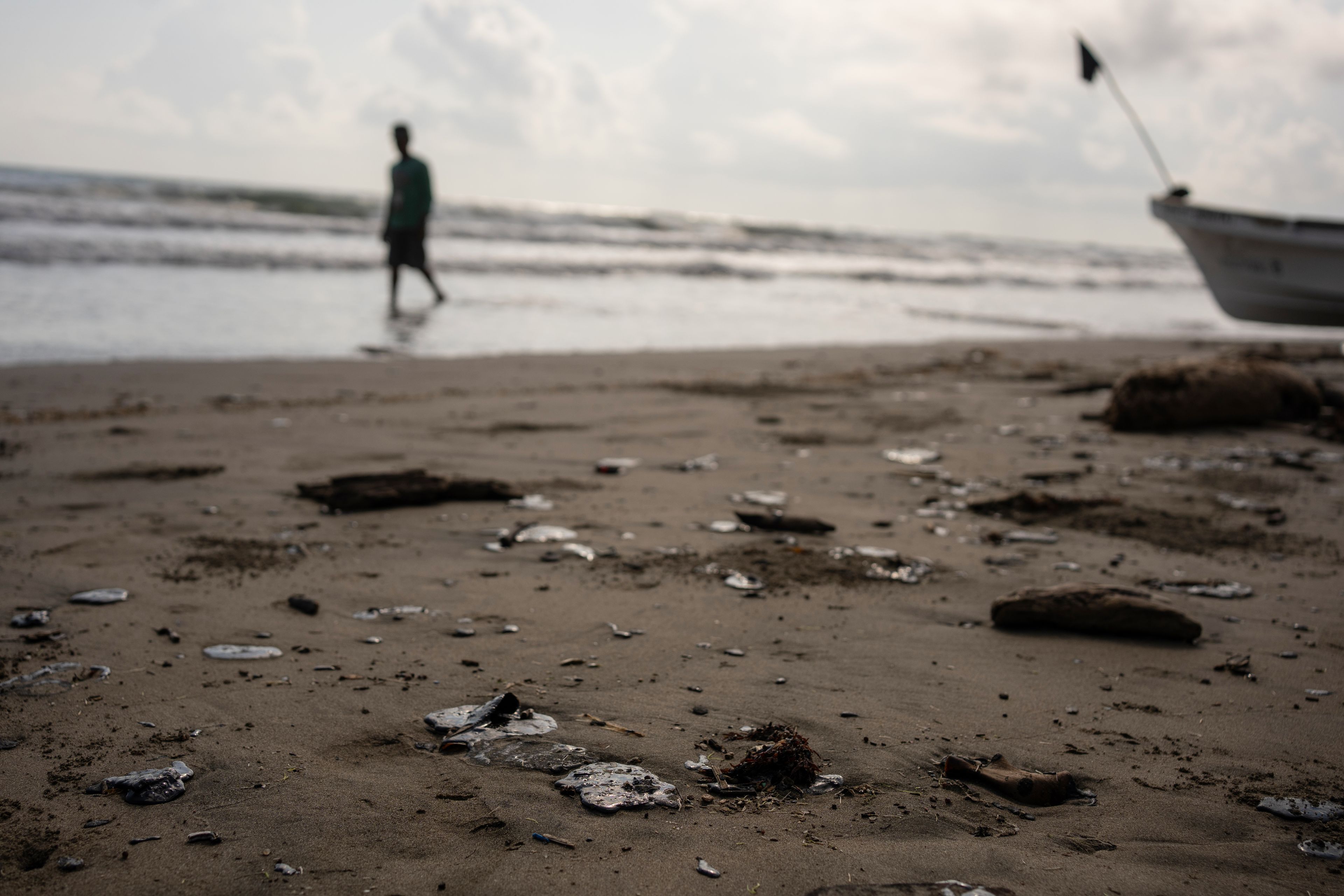 Felix Marquez/Associated Press
Clumps of oil residue lie on the shore Tuesday after fishing outings were suspended because of an oil spill that Mexican authorities said originated from an unidentified vessel and two natural oil seeps along the Gulf coast in Salinas, Mexico.