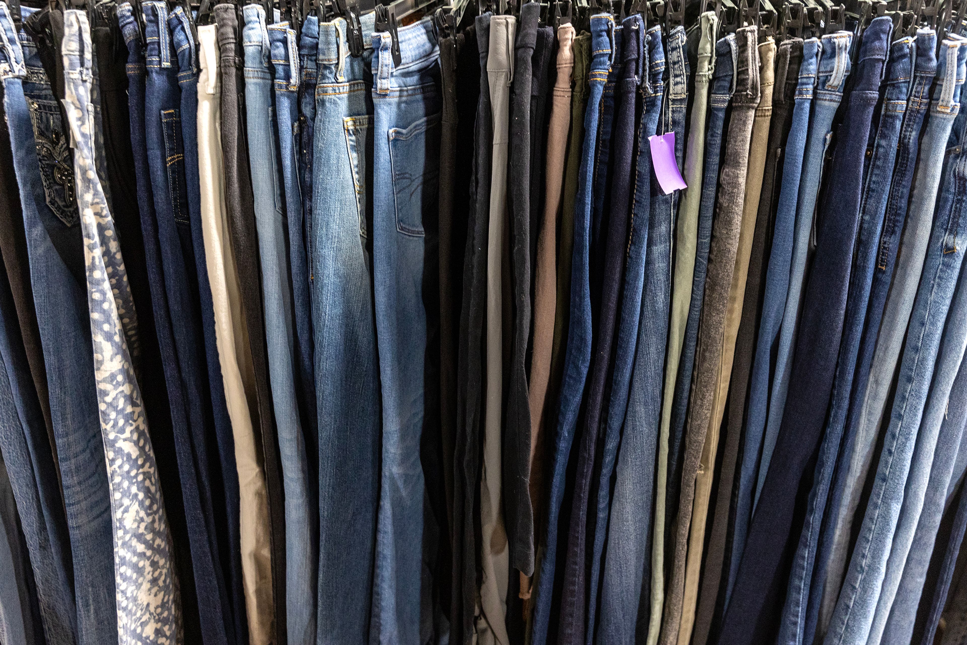 Jeans sit on a rack at Bee’s Knees Resale Thursday in Lewiston.