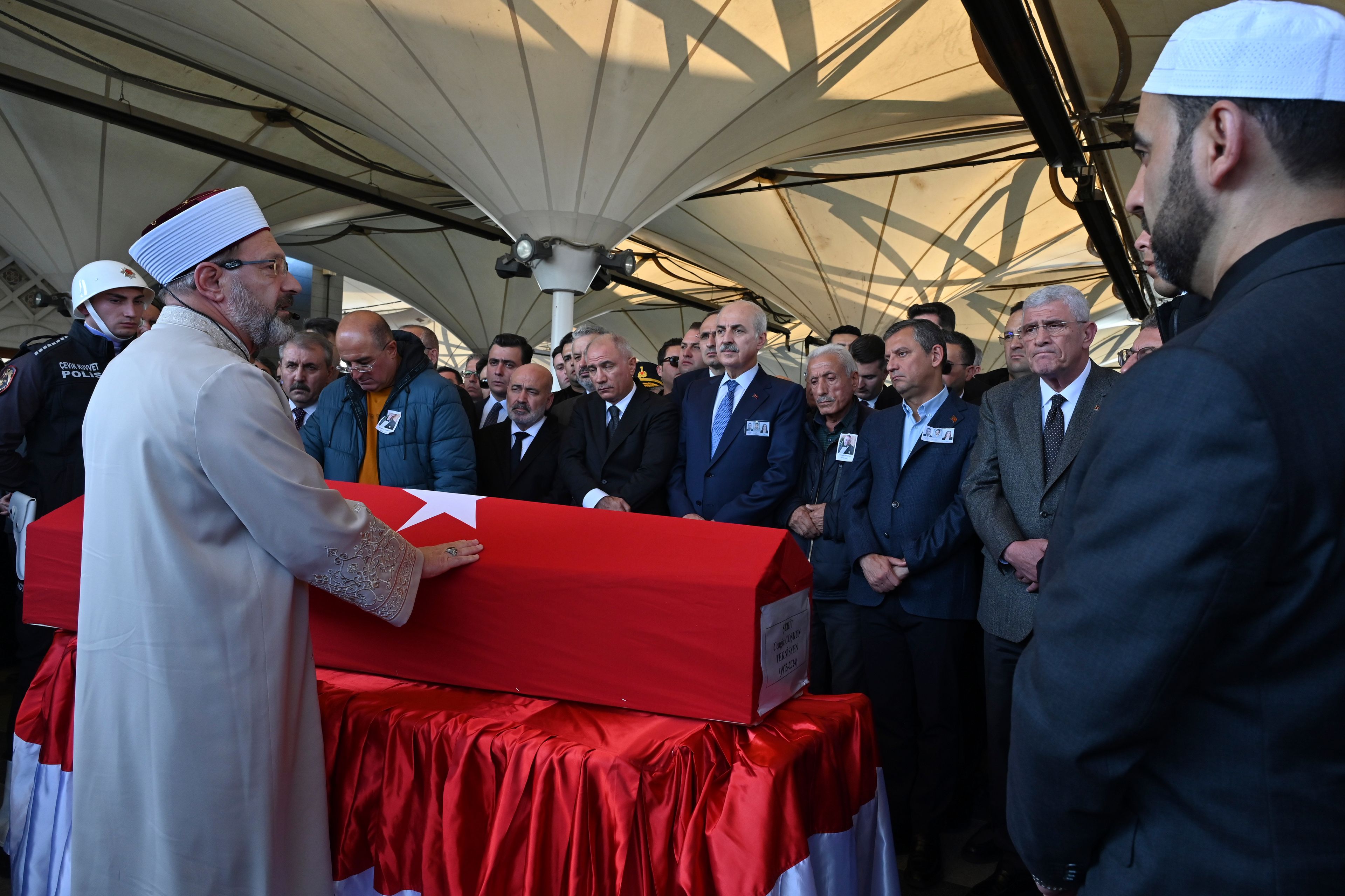 Relatives and authorities pray next to the coffin of Cengiz Coskun, who was killed during an attack by PKK members at the Turkish aerospace and defense company TUSAS on Wednesday, during a funeral at Karsiyaka mosque in Ankara, Thursday, Oct. 24, 2024. (AP Photo/Ali Unal)