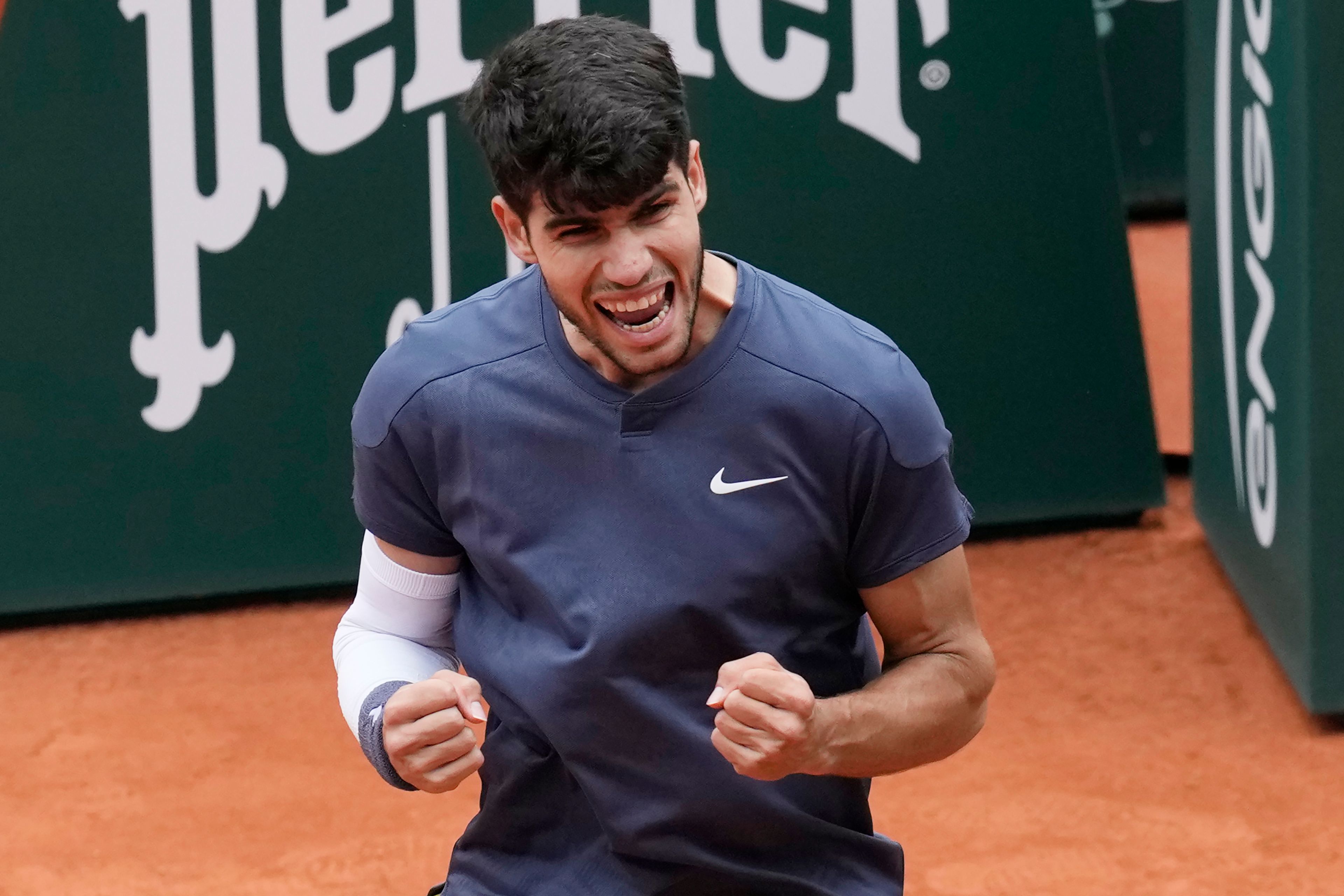 Spain's Carlos Alcaraz celebrates as he won his fourth round match of the French Open tennis tournament against Canada's Felix Auger-Aliassime at the Roland Garros stadium in Paris, Sunday, June 2, 2024.