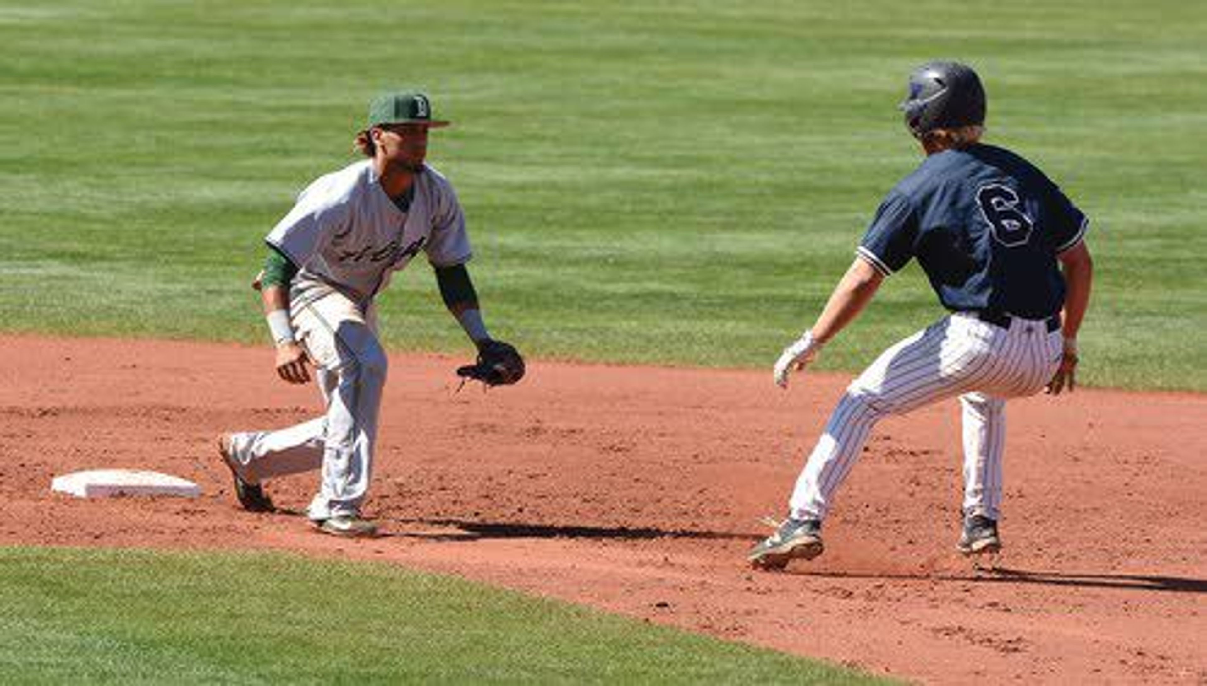 The Masters Max Maitland stalls the tag from University of Seience and Arts Frankely Gonzalez at second to collect the RBI in the fourth inning.