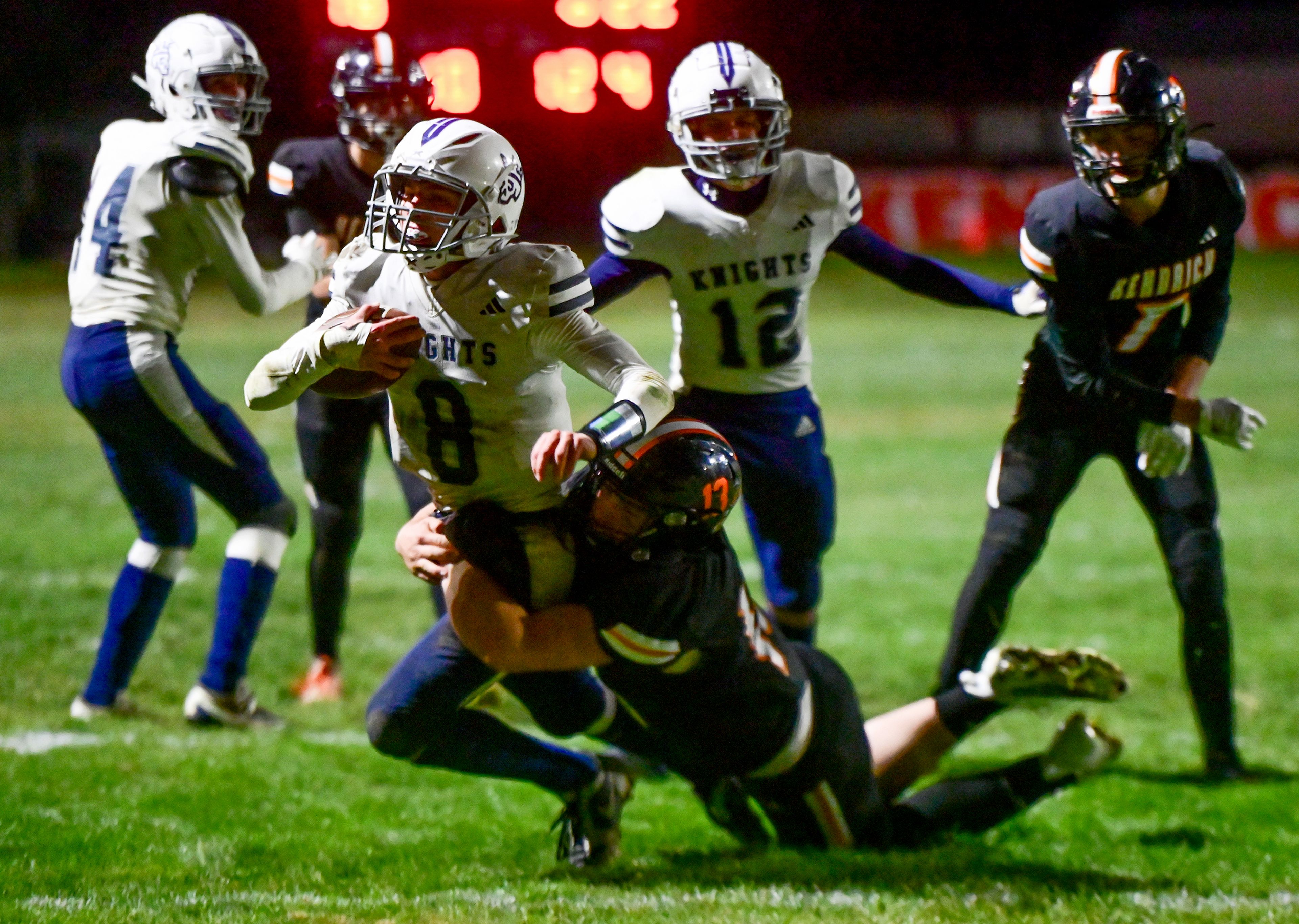 Logos� Seamus Wilson is tackled by Kendrick�s Caleb O�Bryant for a first down near the end zone Friday in Kendrick.,