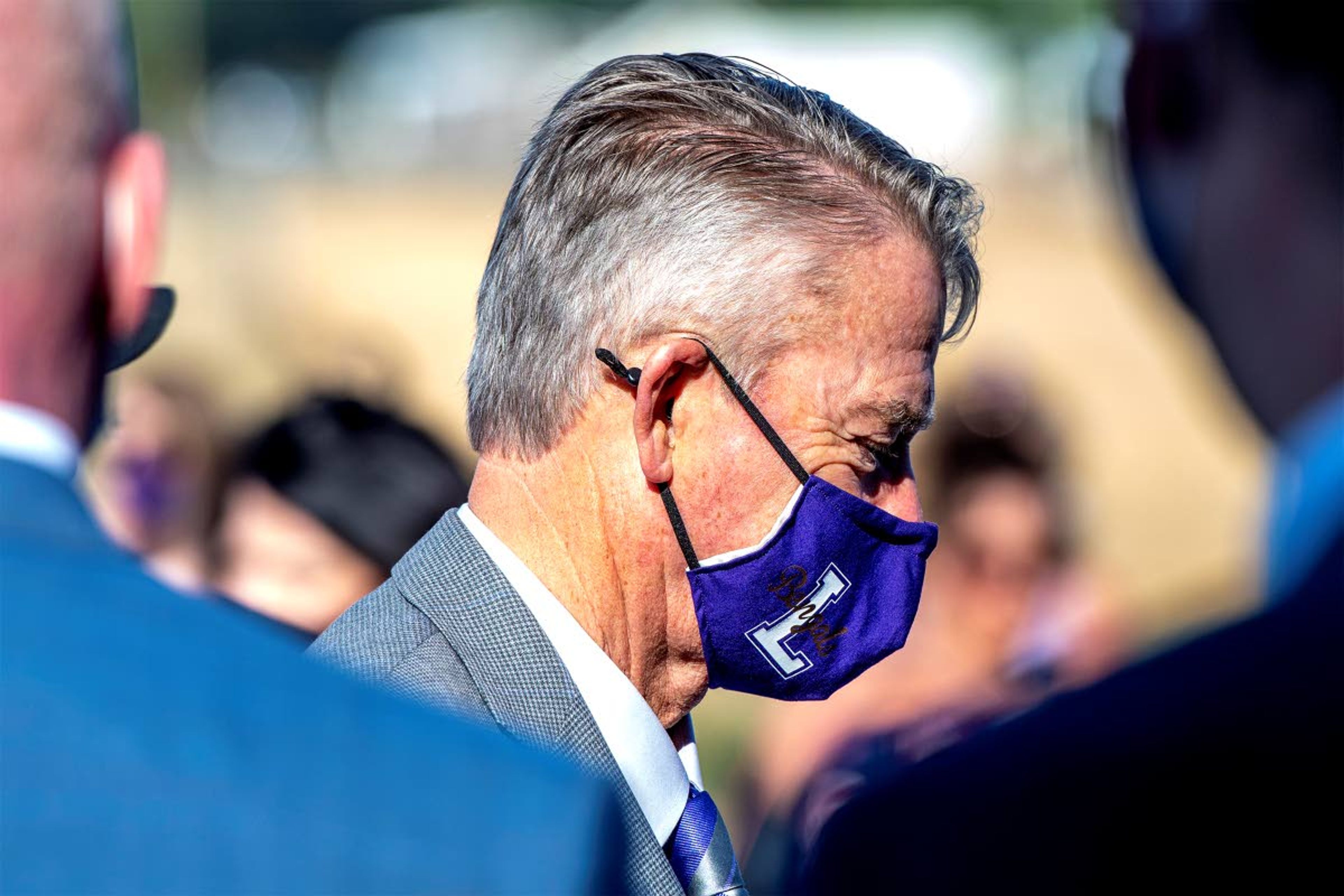 Idaho Gov. Brad Little dons a Lewiston Bengals face mask at the ribbon-cutting events for the new Lewiston High School and the A. Neil DeAtley Career Technical Center on Friday morning.