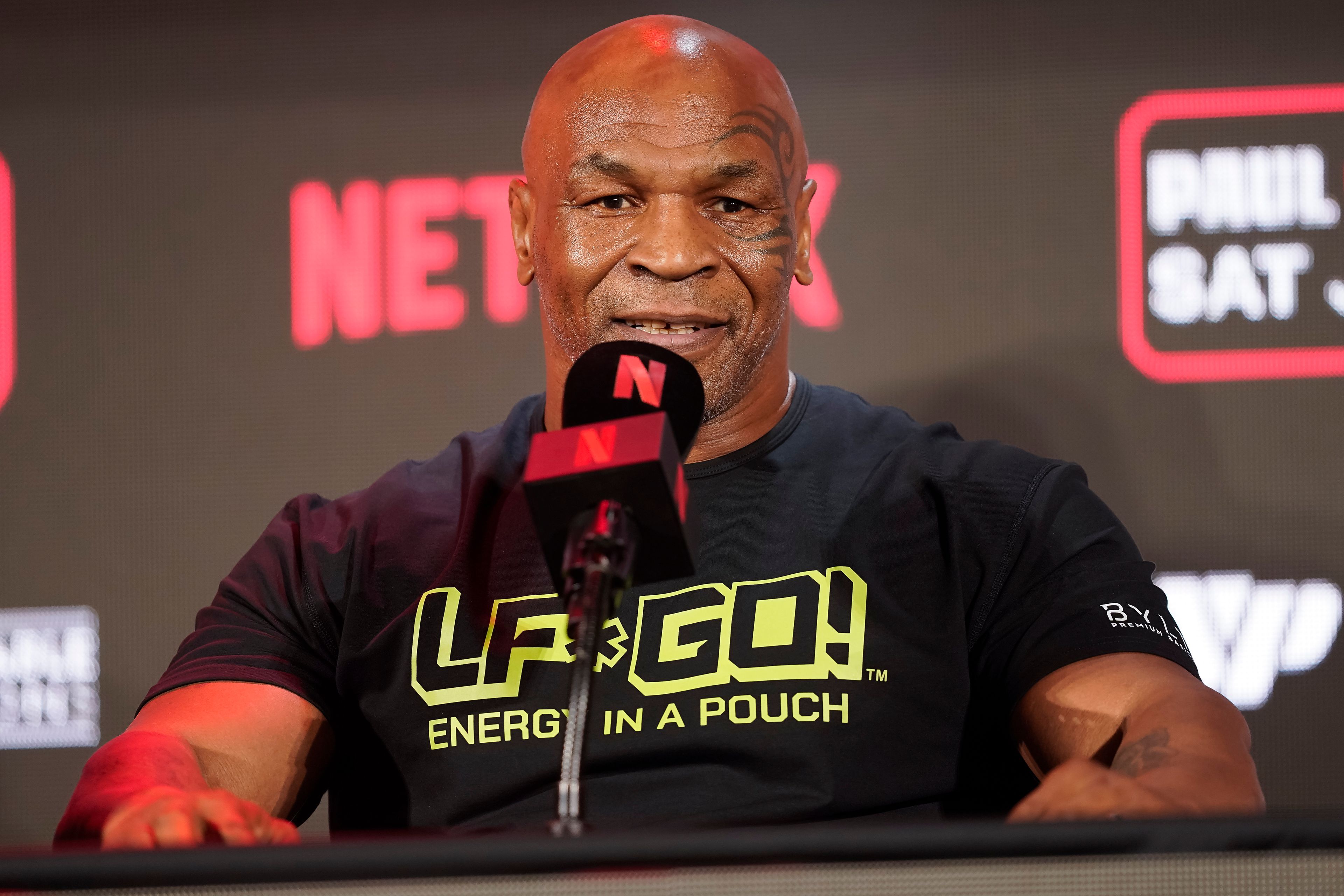 FILE - Mike Tyson speaks during a news conference promoting his upcoming boxing bout against Jake Paul, May 16, 2024, in Arlington, Texas. Tyson was recovering Monday, May 27, after suffering a medical emergency a day earlier during a flight from Miami to Los Angeles, his representatives said. The 58-year-old boxing legend “became nauseous and dizzy due to an ulcer flare up 30 minutes before landing” his publicist's office said in a statement.