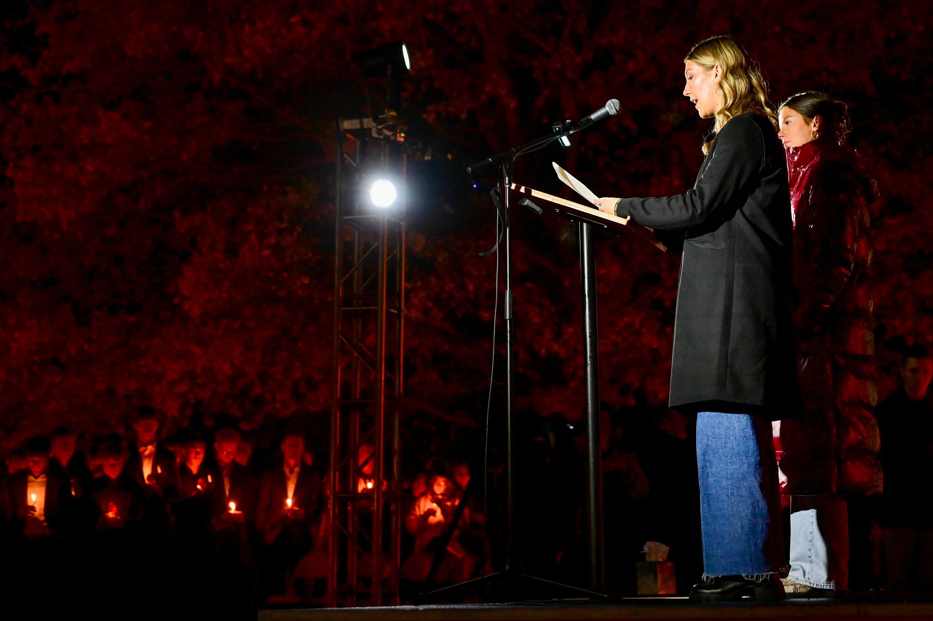 Madison Whitney, center, shares memories of her own and from sisters in sorority Alpha Phi of Kaylee Goncalves, one of the four University of Idaho students killed a year ago in a quadruple homicide, during a vigil on campus Monday.