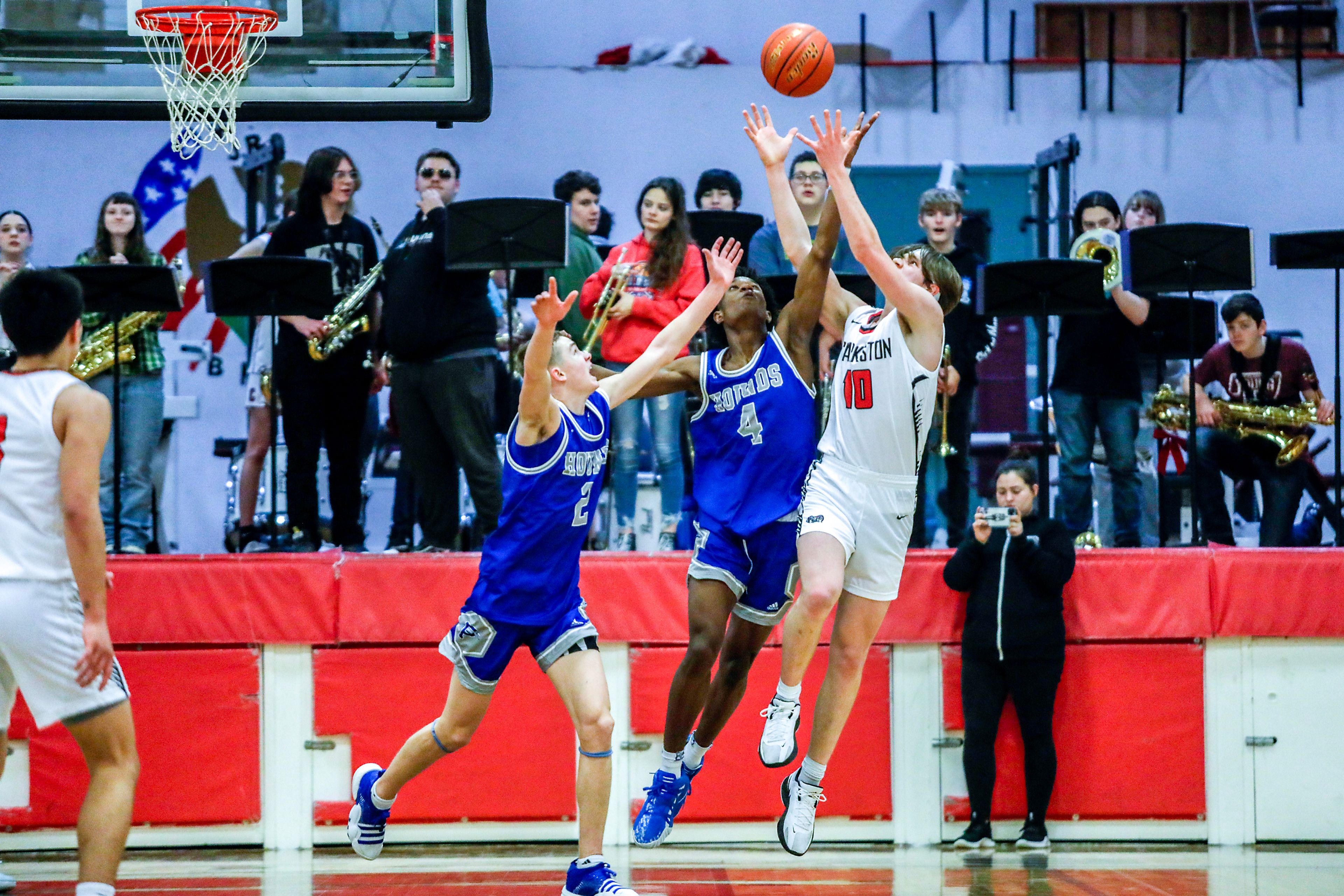 Clarkston forward Carter Steinwand, right, and Pullman shooting guard Champ Powaukee compete for a rebound during Tuesday's Class 2A Greater Spokane League boys basketball game.