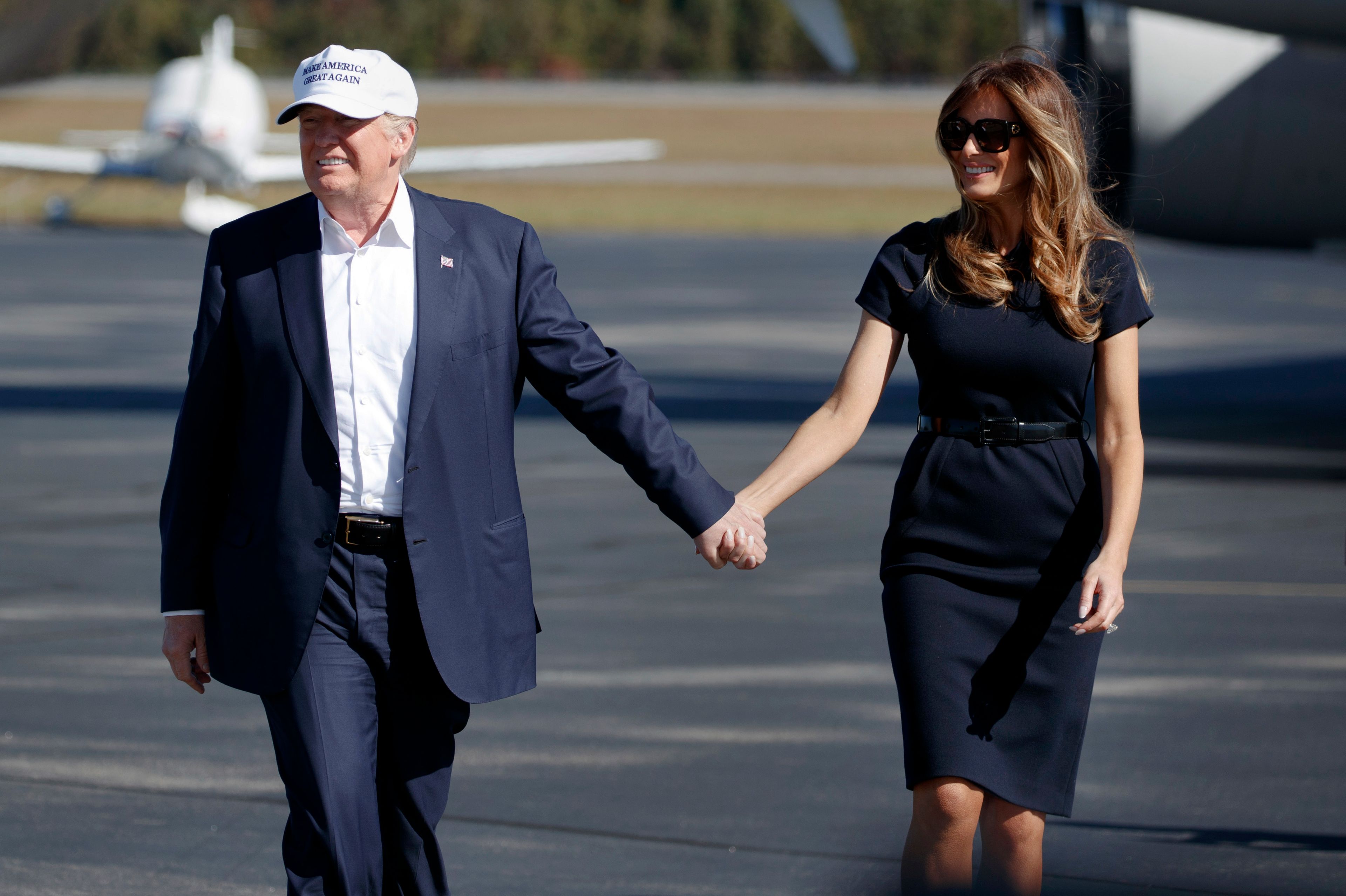 FILE - Republican presidential candidate Donald Trump, left, and his wife Melania arrive to a campaign rally, Nov. 5, 2016, in Wilmington, N.C. (AP Photo/ Evan Vucci, File)