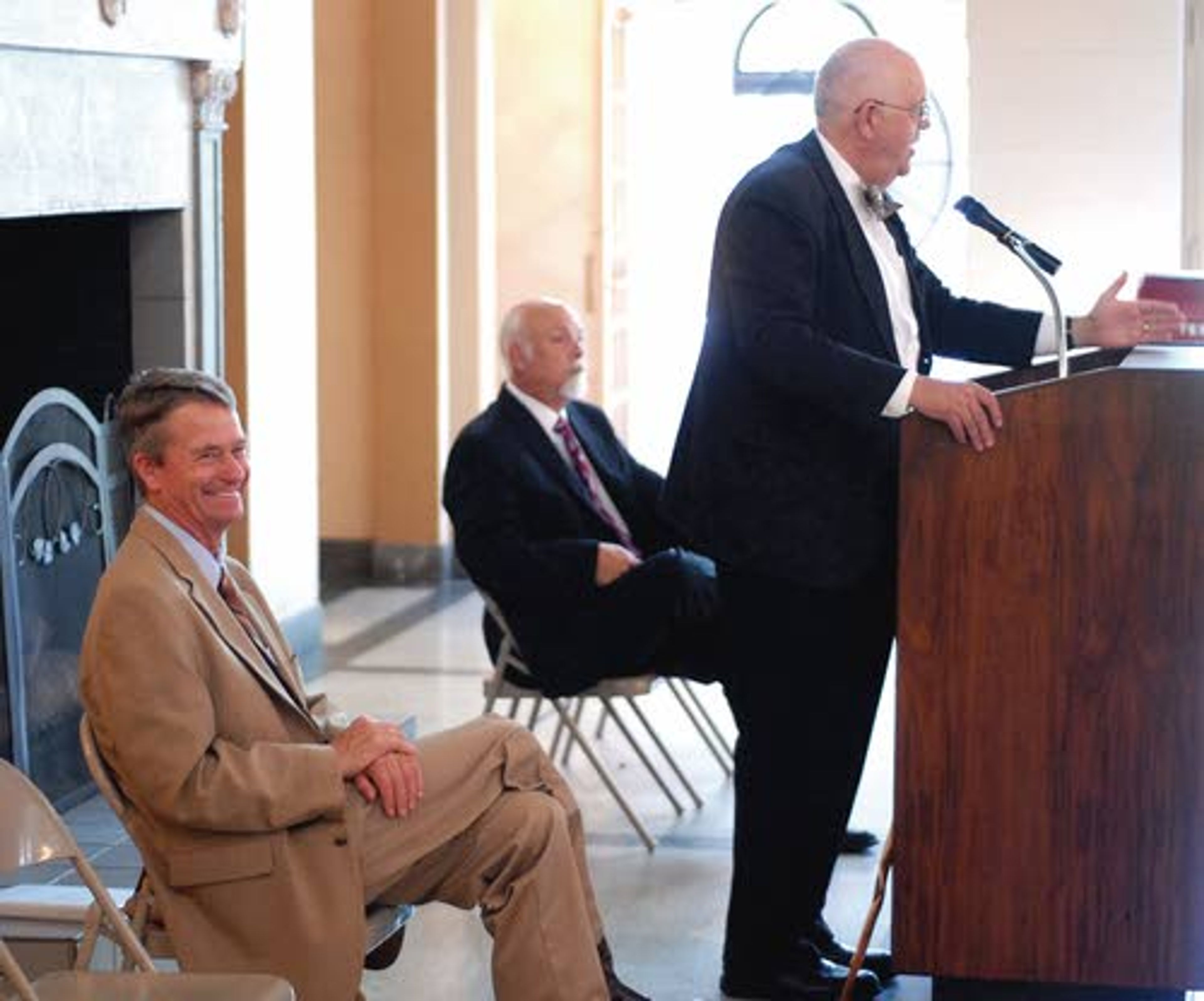 Idaho Lt. Gov Brad Little and Lewiston City Manager Jim Bennett hear about the tough times of delivering mail in early Lewiston from historian Steve Branting.