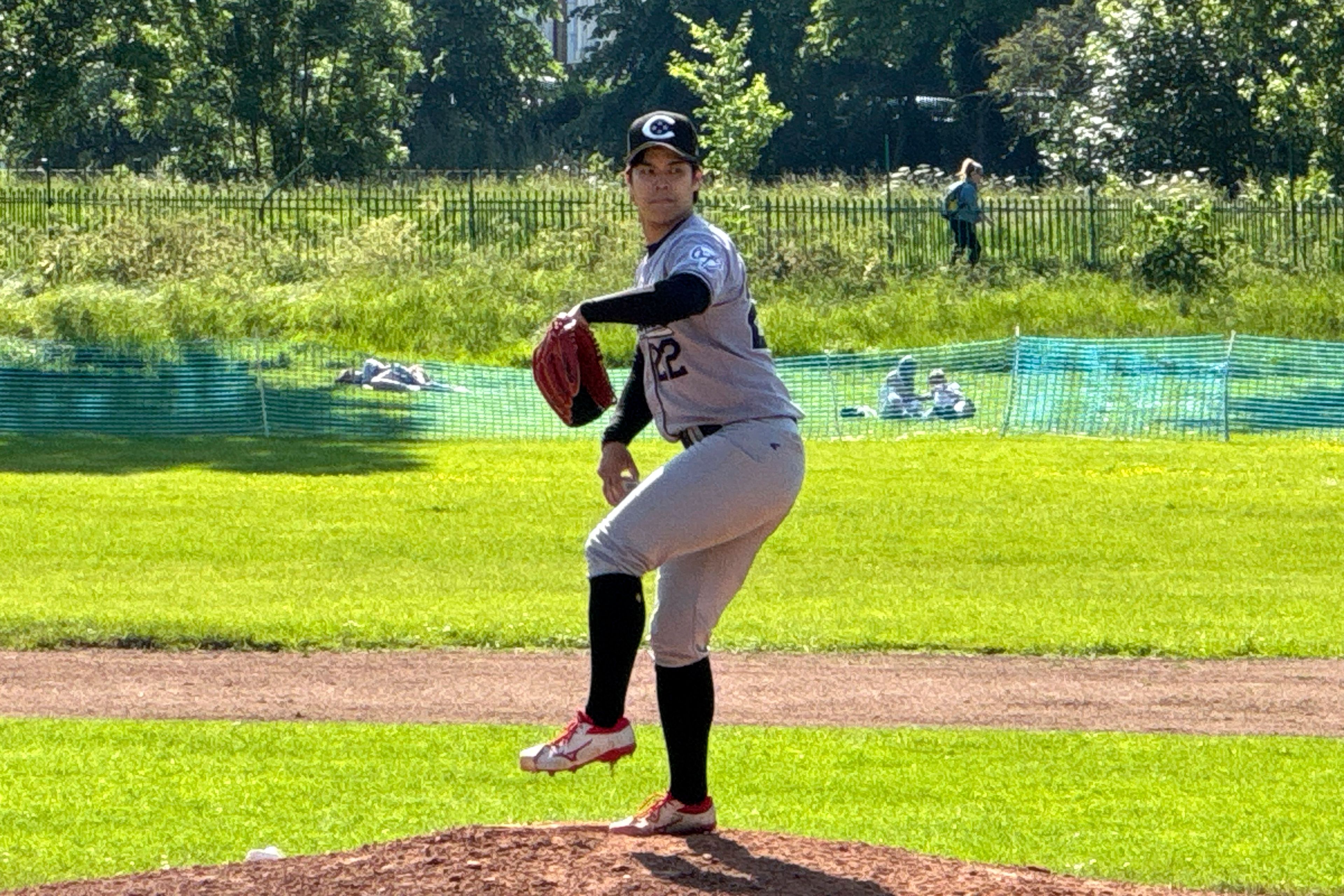 London Capitals pitcher Masa Hashiguchi throws a pitch in a National Baseball League game against Vetra BC on Sunday, June 2, 2024, at Finsbury Park in London. The London Mets are the reigning NBL champions and have a strong rivalry with the Capitals. The amateur league is comprised of expats and locals who typically work jobs and play baseball on the side.