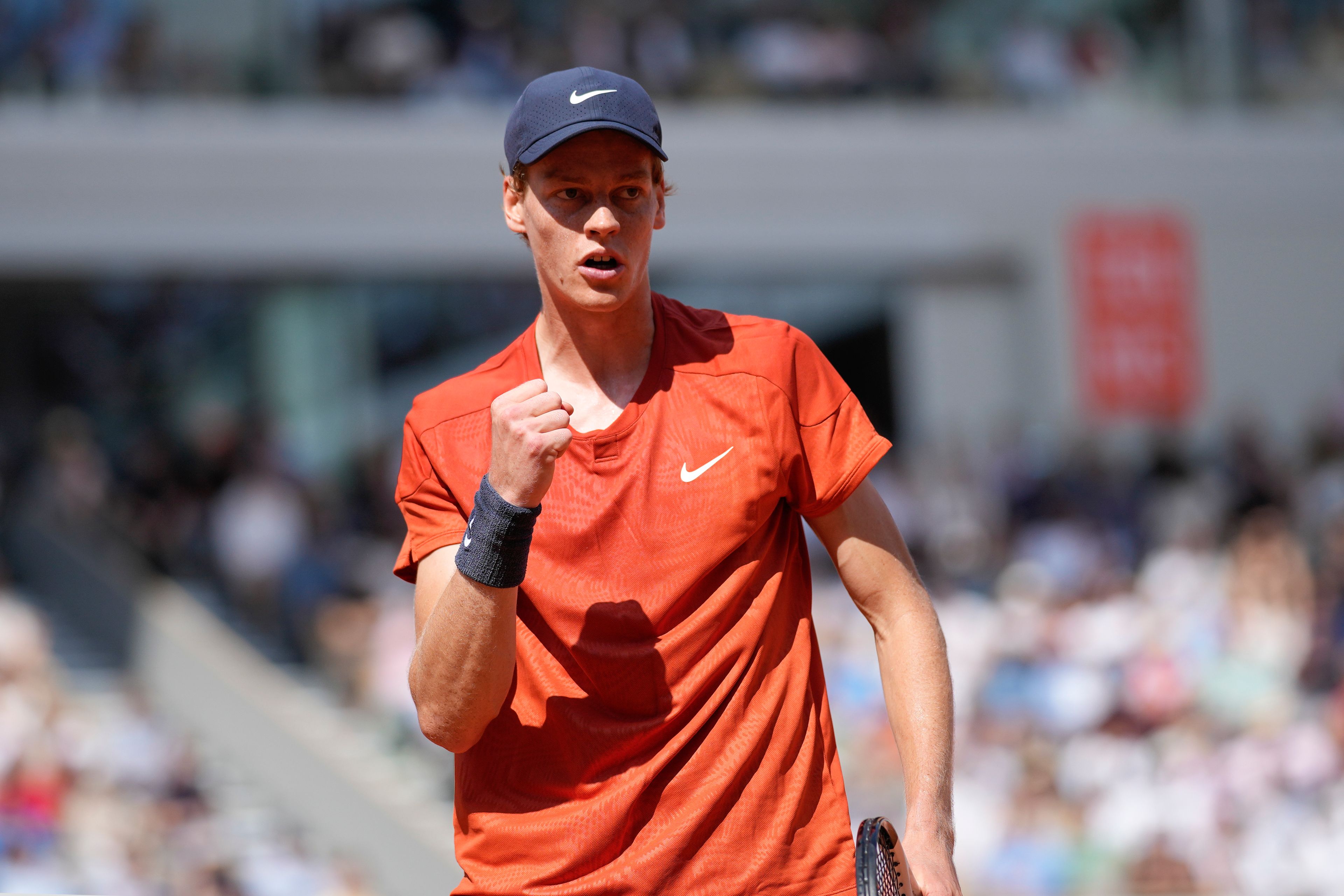 Italy's Jannik Sinner clenches his fist after scoring a point against Bulgaria's Grigor Dimitrov during their quarterfinal match of the French Open tennis tournament at the Roland Garros stadium in Paris, Tuesday, June 4, 2024.