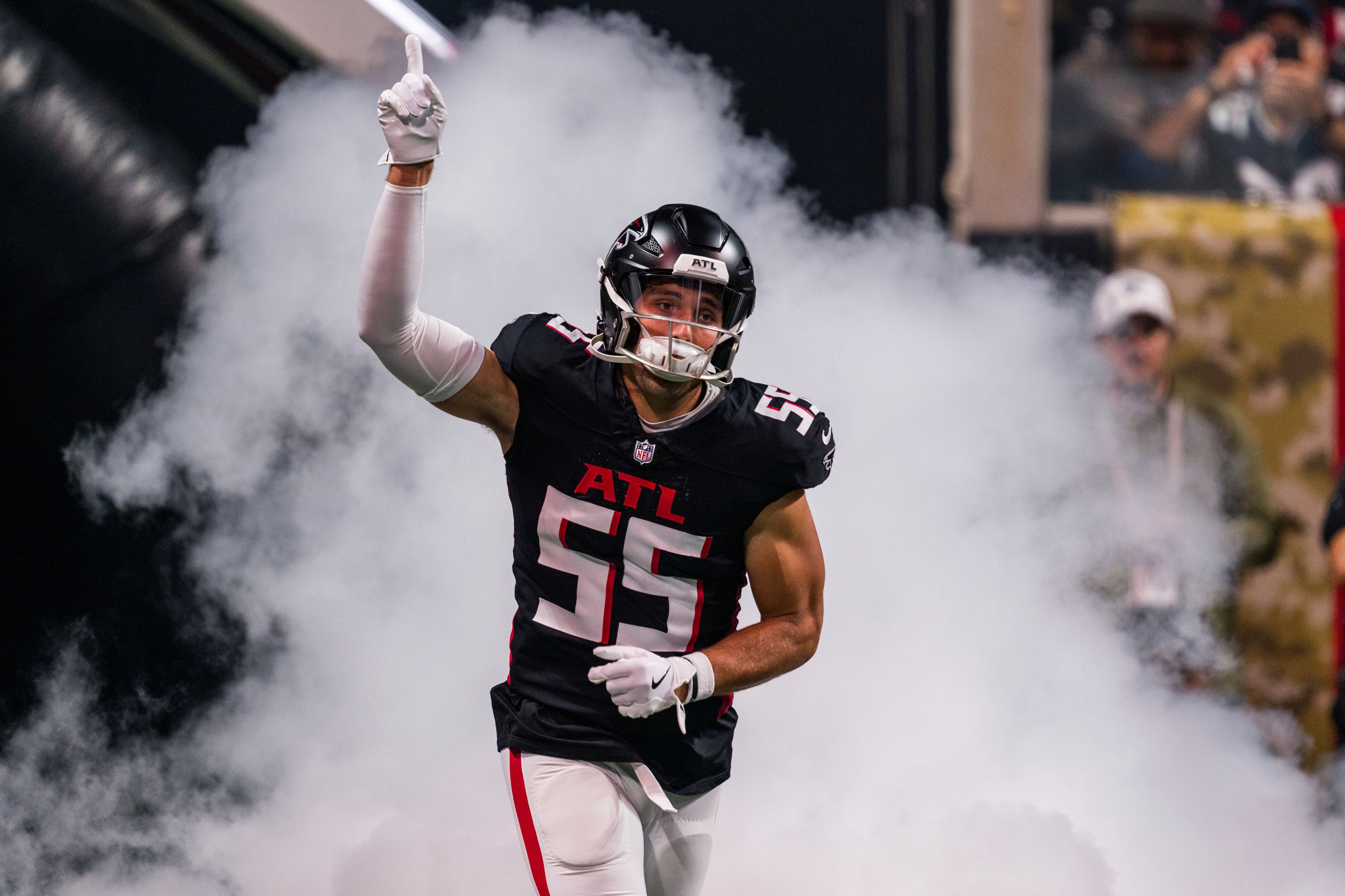 Atlanta Falcons linebacker Kaden Elliss (55) runs out for player introductions before the first half of an NFL football game against the Dallas Cowboys, Sunday, Nov. 3, 2024, in Atlanta. The Falcons defeated the Cowboys 27-21. (AP Photo/Danny Karnik)