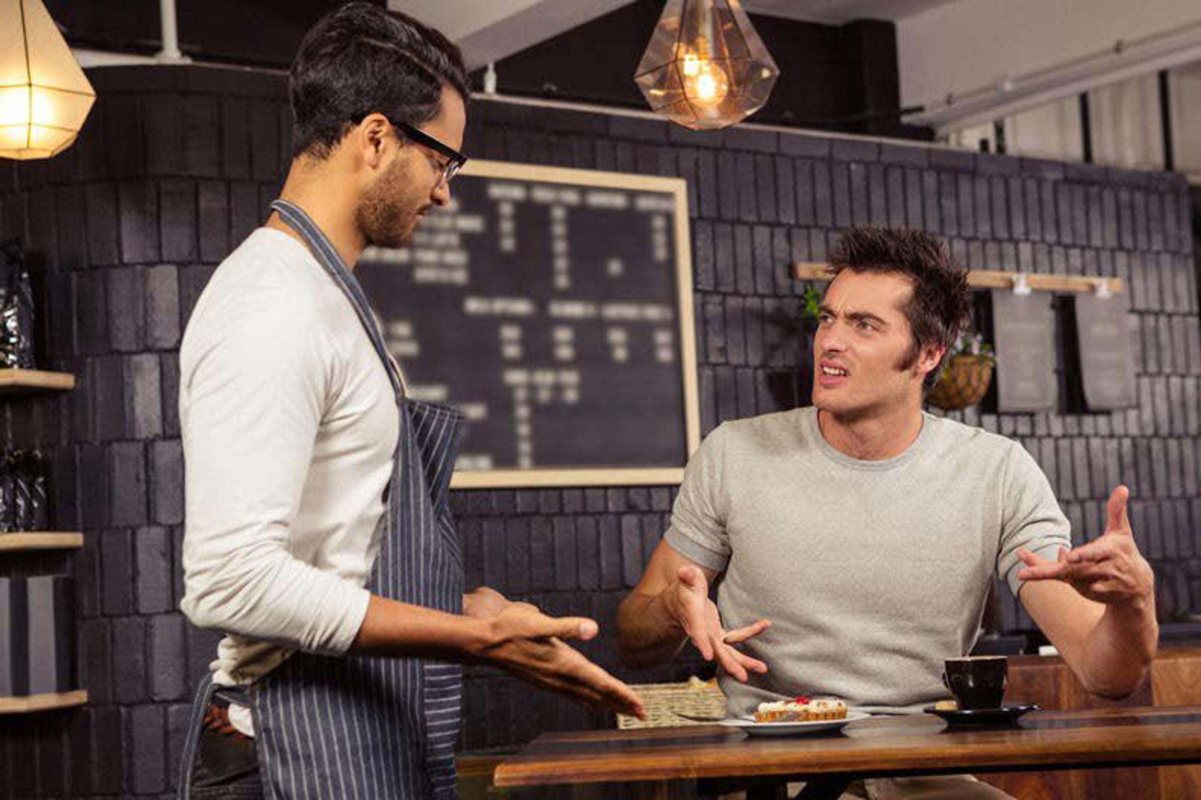 Interactions between waitstaff and diners, like the one portrayed in this photo illustration, matter to restaurant customers, according to a study completed by a team that included a Washington State University professor. Customers are inclined to reduce tips or not return based on how they see others being treated.