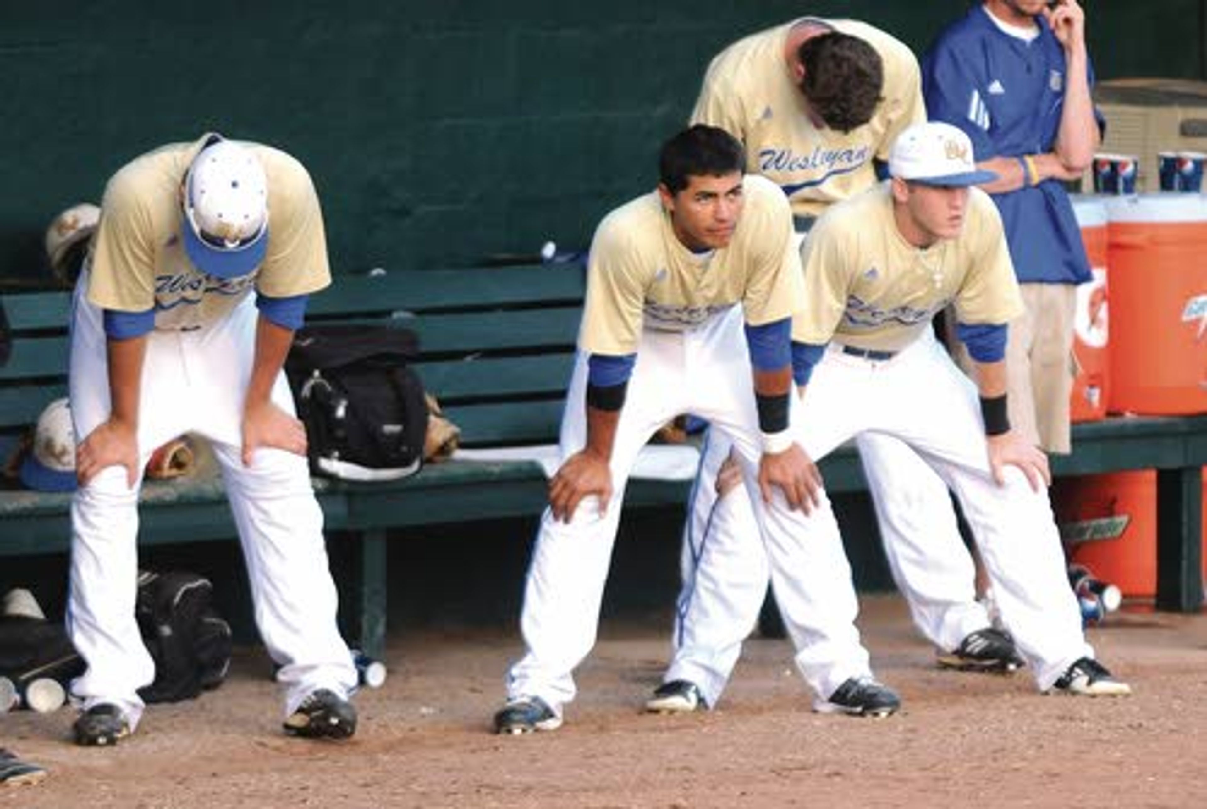 Tennessee Wesleyan players watch somberly from the dugout as the game slips away and impending defeat — the Bulldogs’ first in the Series — sets in against LSU Shreveport.