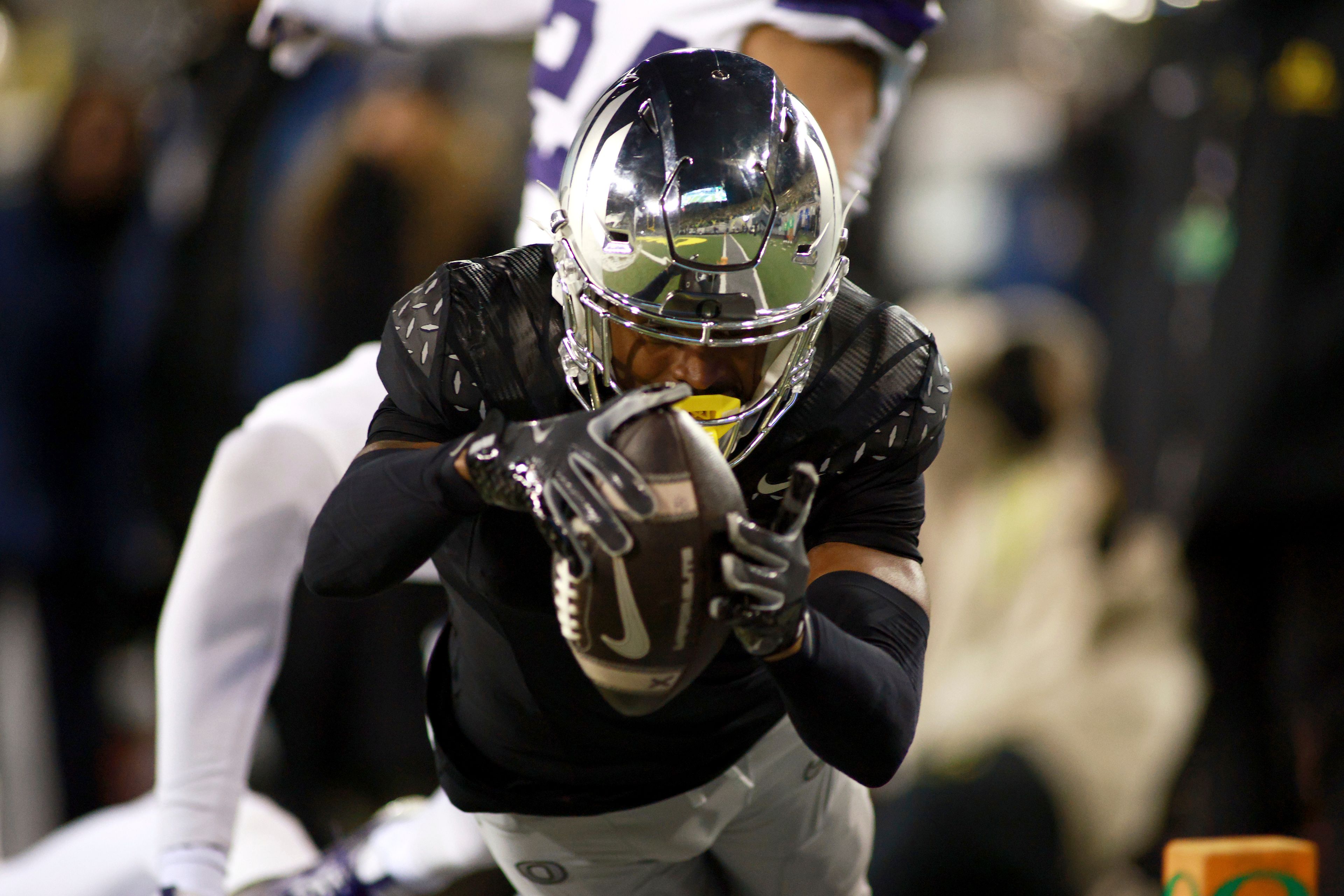 Oregon wide receiver Traeshon Holden dives for the end zone, but falls short of a touchdown during an NCAA college football game against Washington, Saturday, Nov. 30, 2024, in Eugene, Ore. (AP Photo/Lydia Ely)