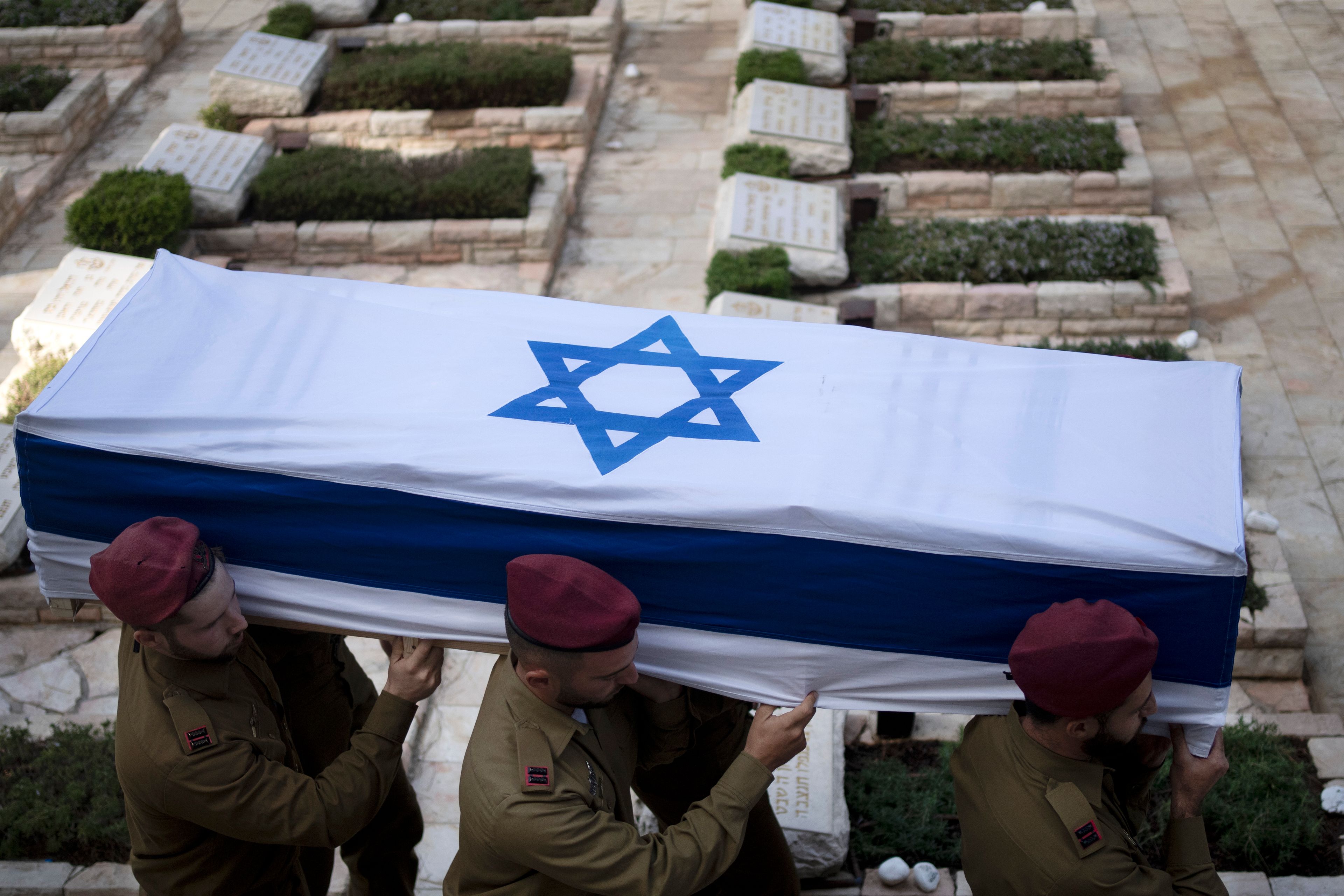 Soldiers carry the coffin of Israeli Army Capt. Eitan Yitzhak Oster, who was killed in action in Lebanon, during his funeral at Mt. Herzl military cemetery in Jerusalem, Wednesday, Oct. 2, 2024. (AP Photo/Maya Alleruzzo)