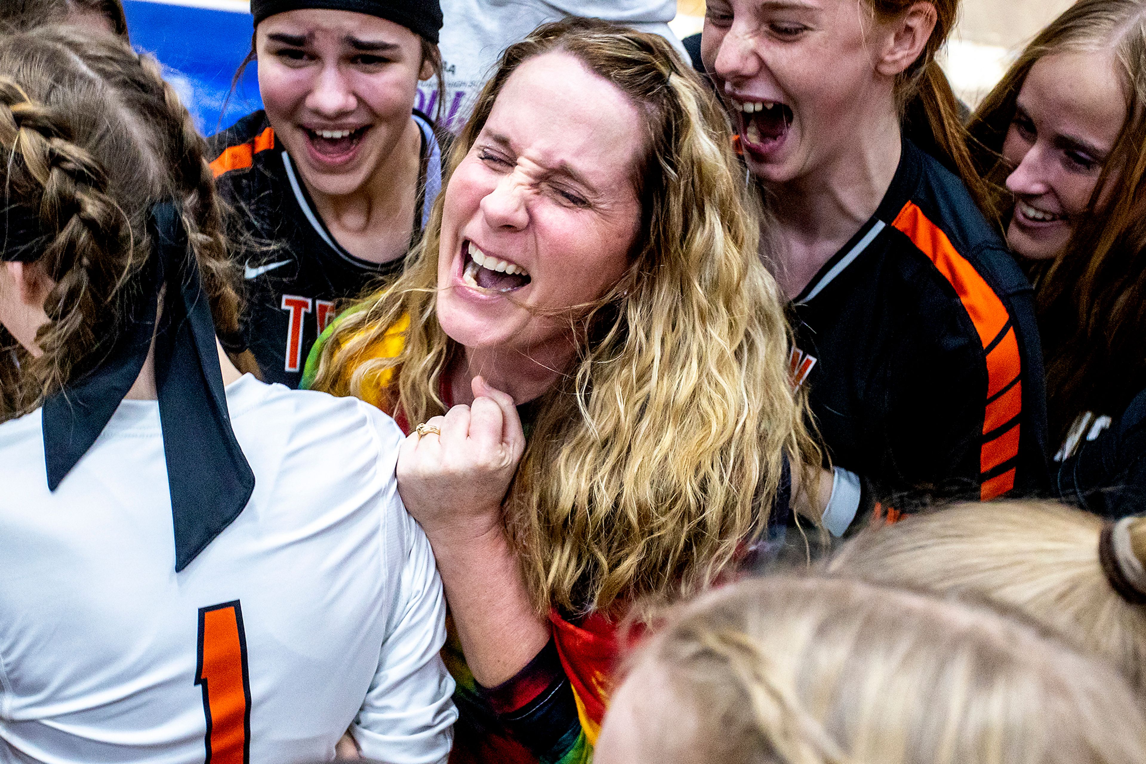 Troy volleyball coach Deborah Blazzard, center, celebrates with her team after defeating Grace to win the 1A DI state championship Oct. 30, 2021, at the P1FCU Activity Center in Lewiston.