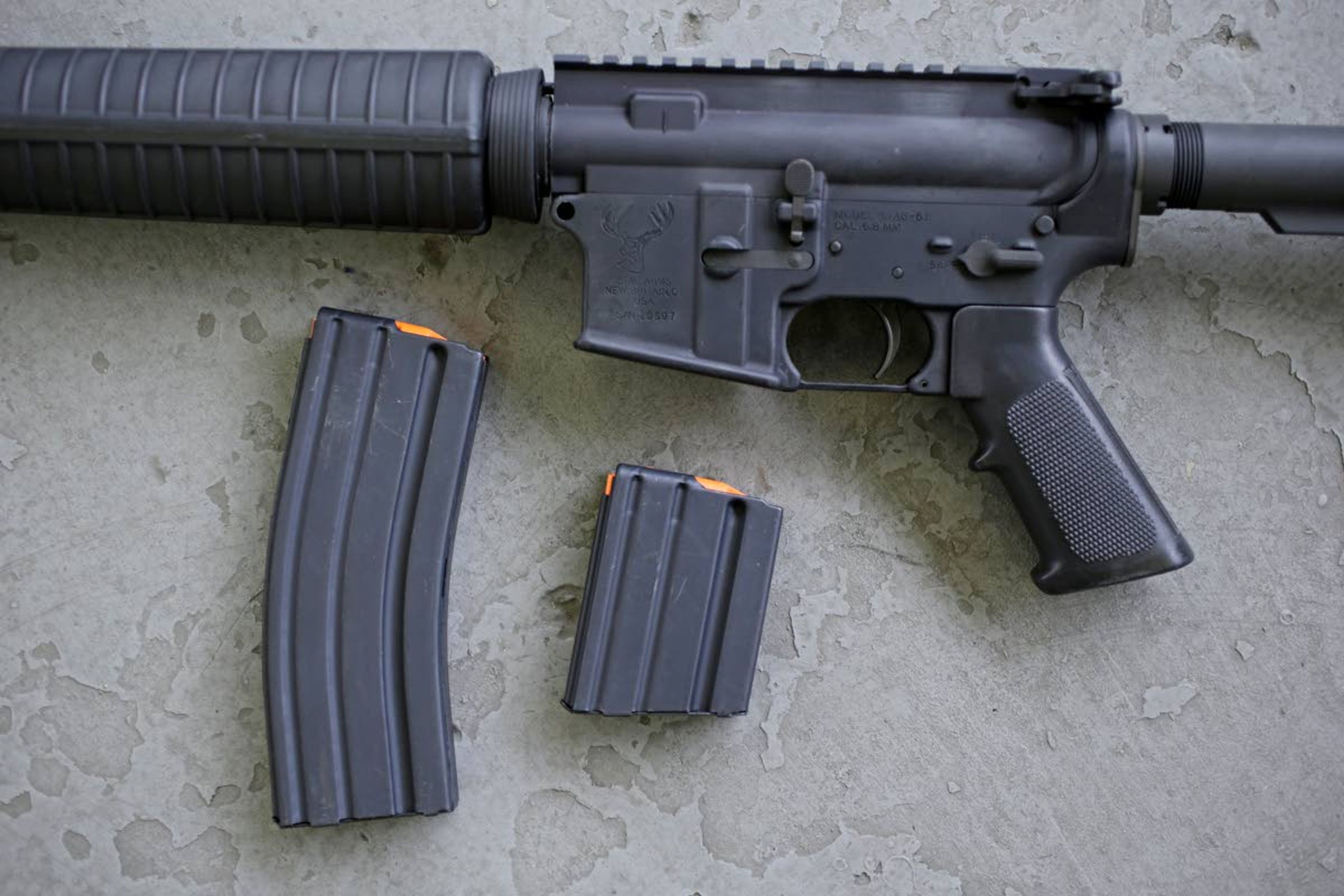 A stag arms AR-15 rifle with 30 round (left) and 10 round magazines is displayed April 10, 2013, in New Britain, Conn.