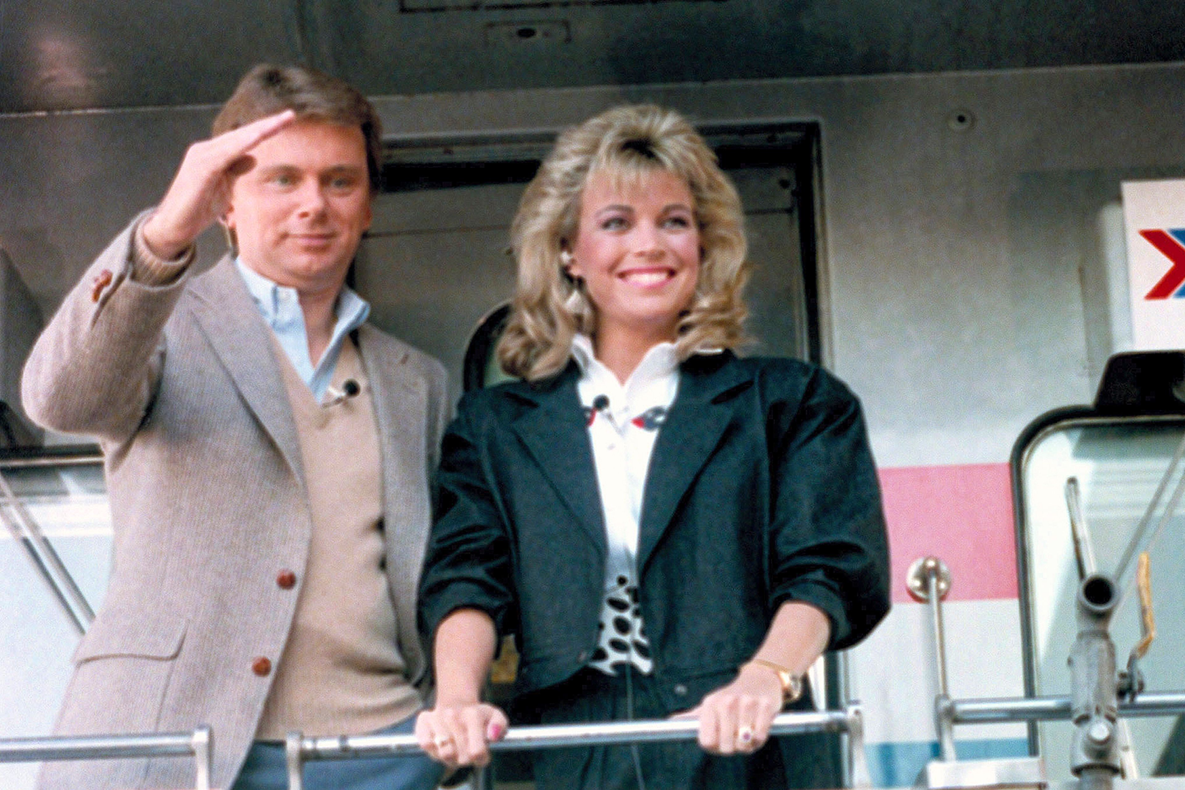 FILE - Pat Sajak, left, and Vanna White appear aboard the Wheel of Fortune Express in Miami on Feb. 12, 1987 to tour 33 cities from Miami to Washington, DC.