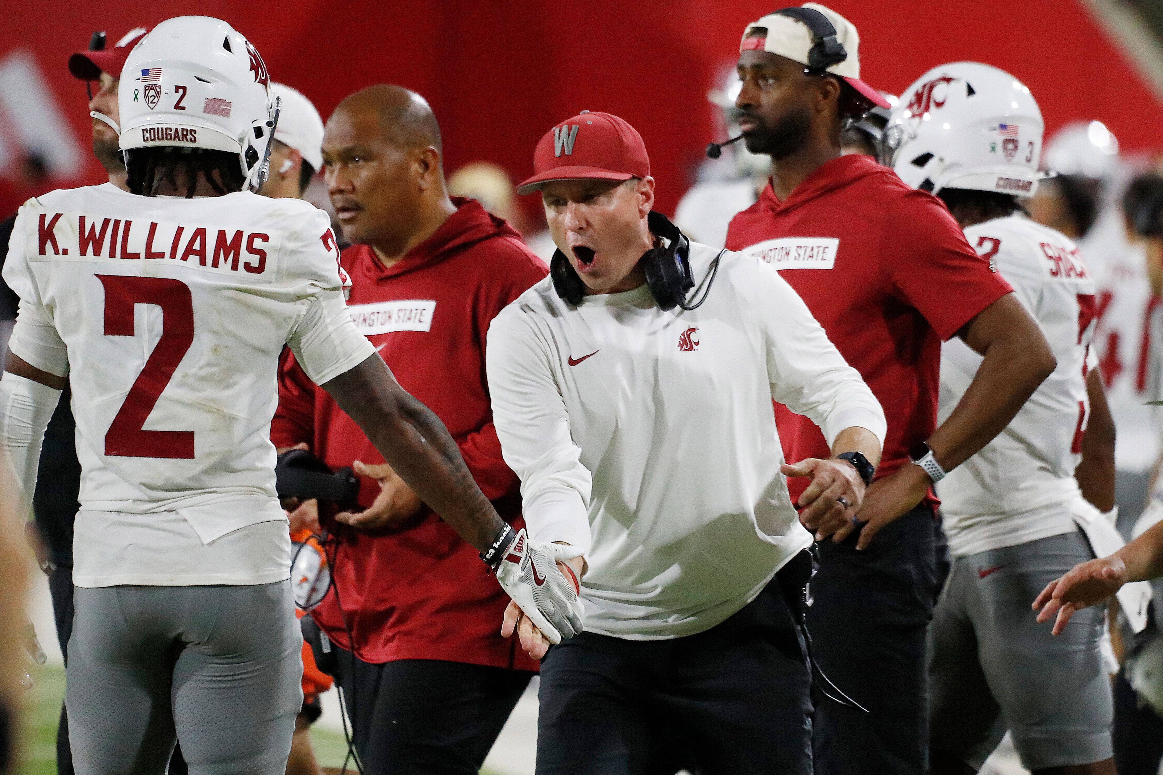 Washington State head coach Jake Dickert fires up his team against Fresno State during the second half of an NCAA college football game in Fresno, Calif., Saturday, Oct. 12, 2024. (AP Photo/Gary Kazanjian)