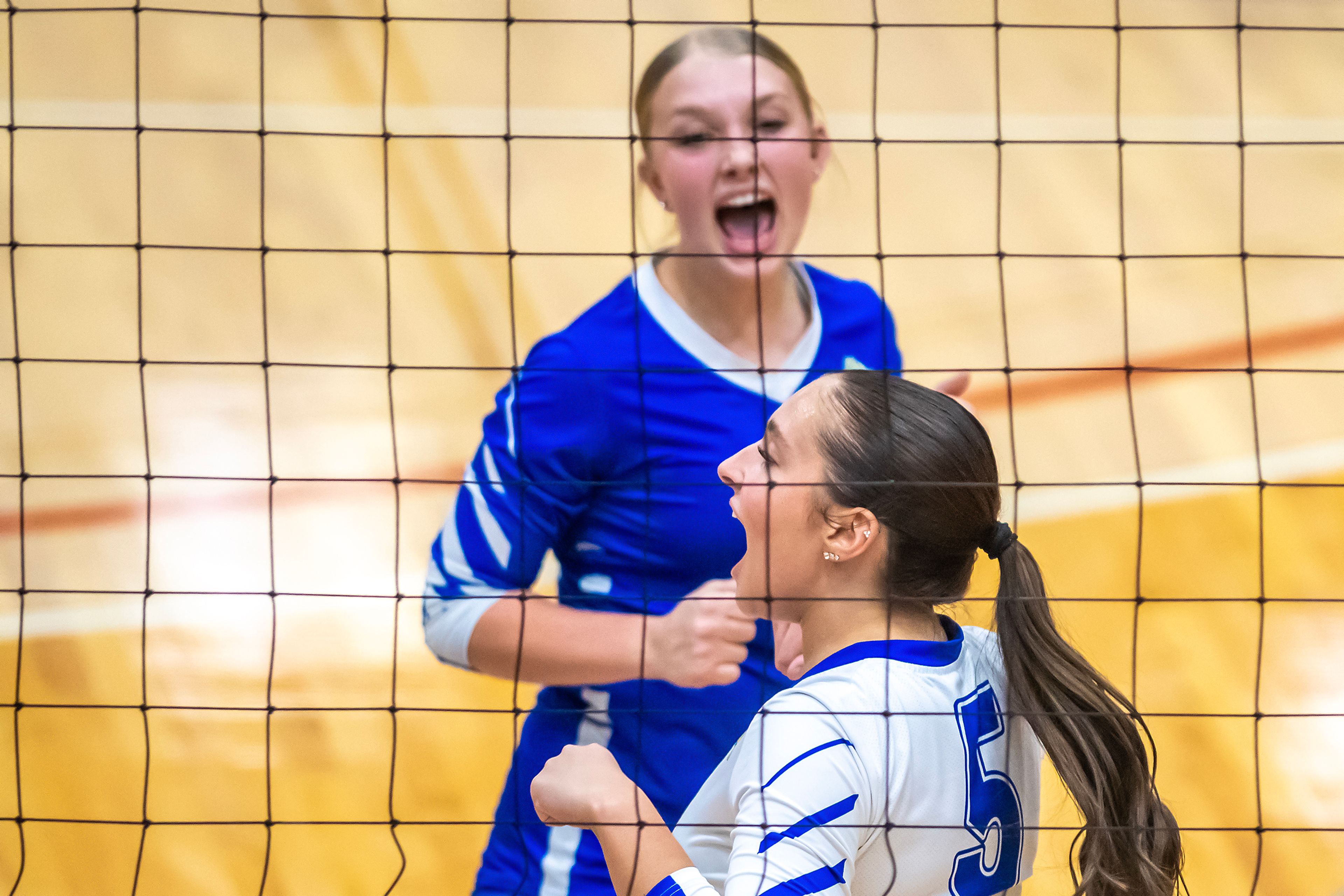 Genesee outside hitter Chloe Grieser cheers after she scored a point against St. John Bosco in a 1A district championship Thursday at the P1FCU Activity Center in Lewiston.,