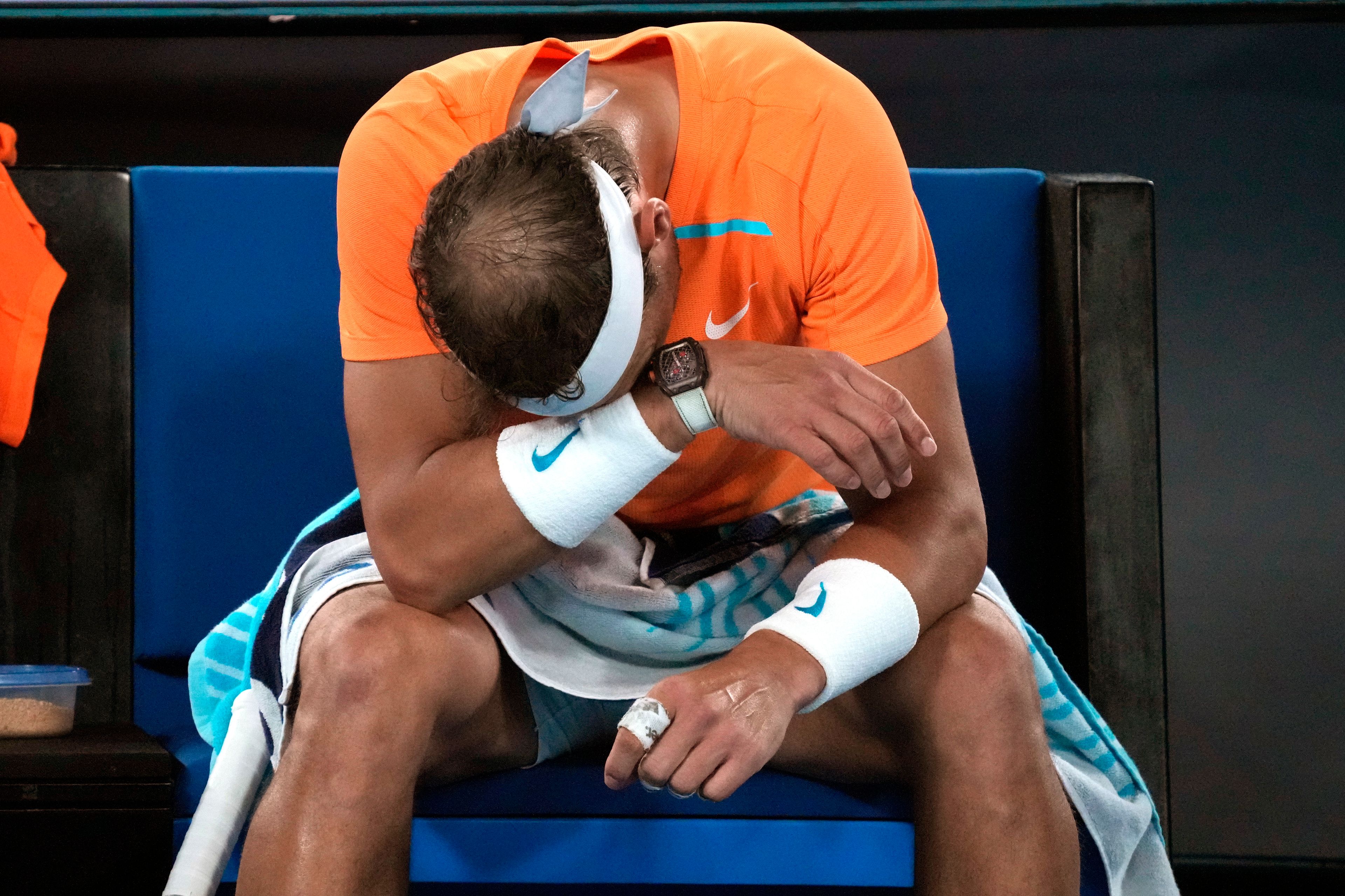 Rafael Nadal of Spain reacts during his second round loss to Mackenzie McDonald of the U.S. at the Australian Open tennis championship in Melbourne, Australia, Wednesday, Jan. 18, 2023. (AP Photo/Dita Alangkara)