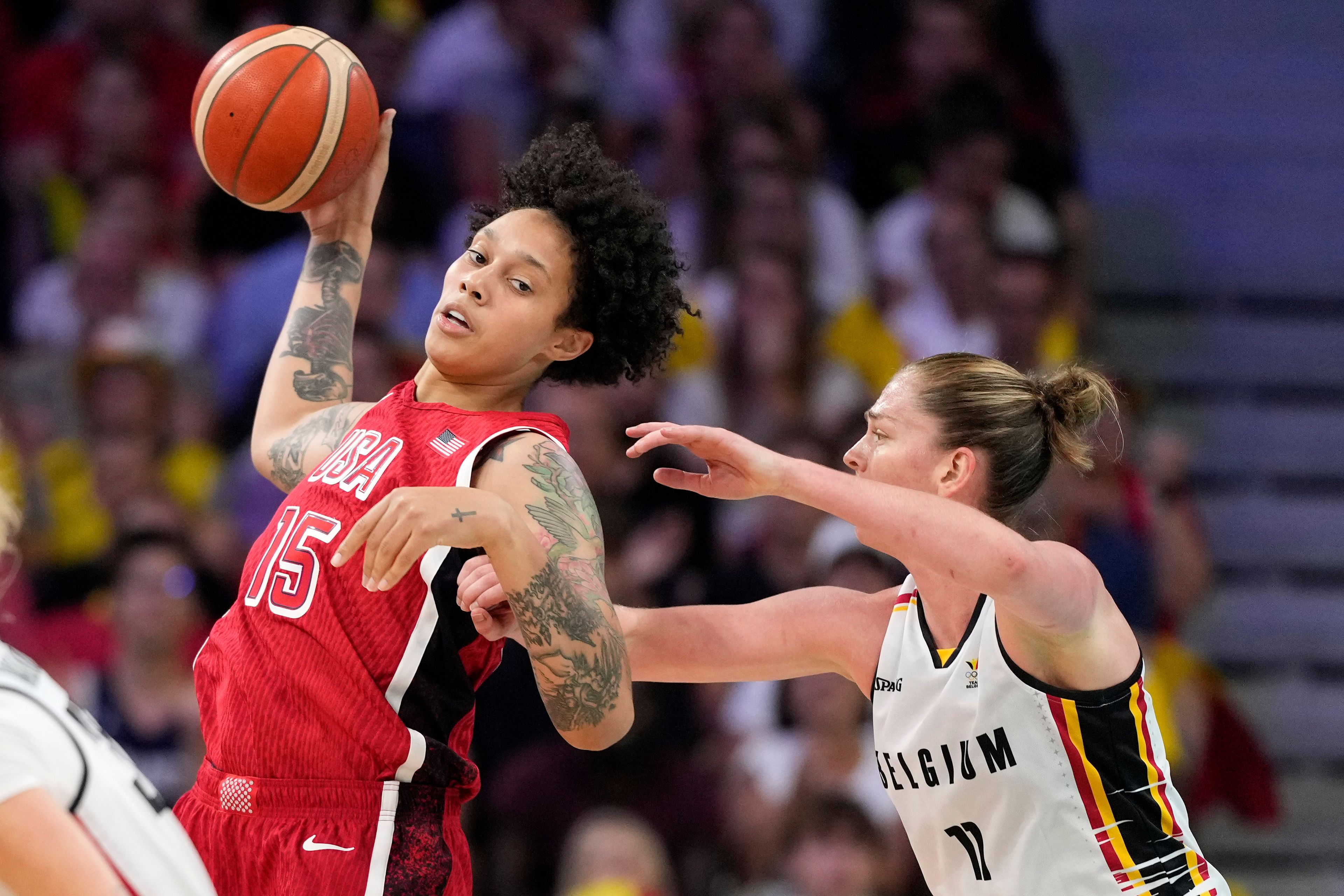 United States' Brittney Griner, left, pushes toward the basket as Belgium's Emma Meesseman defends during a women's basketball game at the 2024 Summer Olympics, Thursday, Aug. 1, 2024, in Villeneuve-d'Ascq, France. (AP Photo/Michael Conroy)