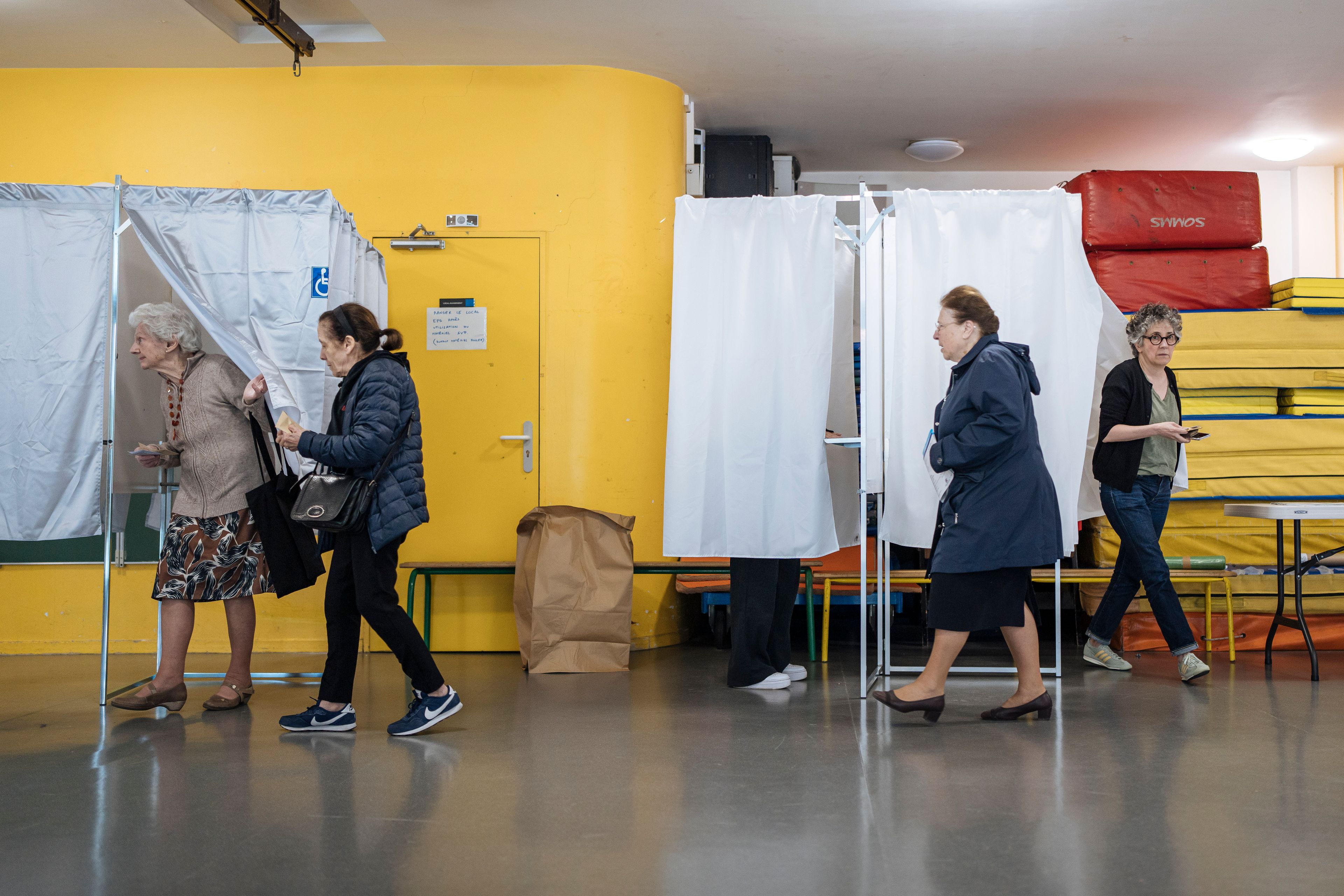 People queue to vote for the European Parliament elections, Sunday, June 9, 2024 in Paris. Polling stations opened across Europe on Sunday as voters from 20 countries cast ballots in elections that are expected to shift the European Union's parliament to the right and could reshape the future direction of the world's biggest trading bloc.