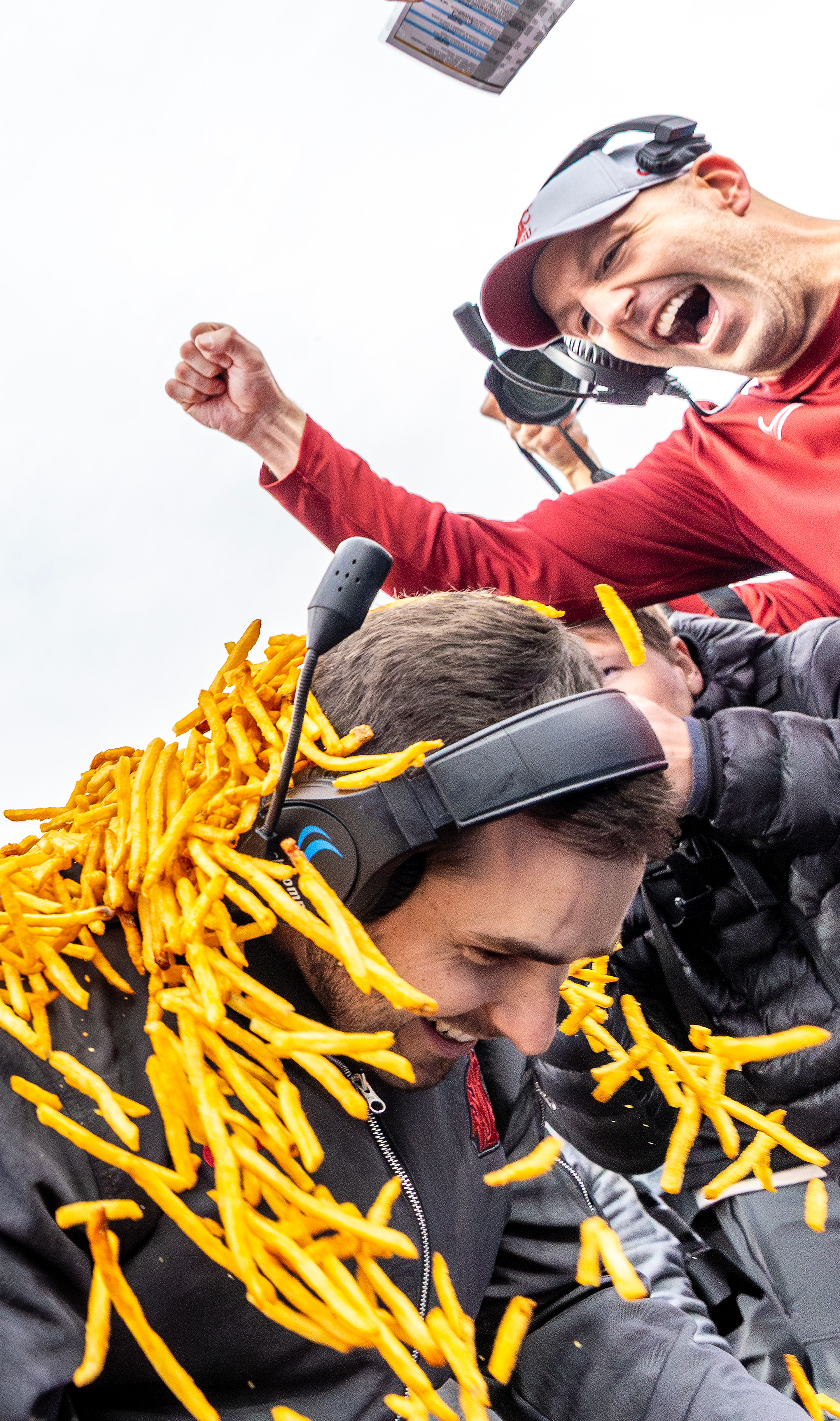 Washington State University interim head football coach Jesse Bobbit is covered in french fries after the Cougars defeated Utah State University in the Famous Idaho Potato Bowl on Monday at Albertsons Stadium in Boise. WSU defeated Utah State 34-21 to earn the bowl game title and the shower of delicious French fries.