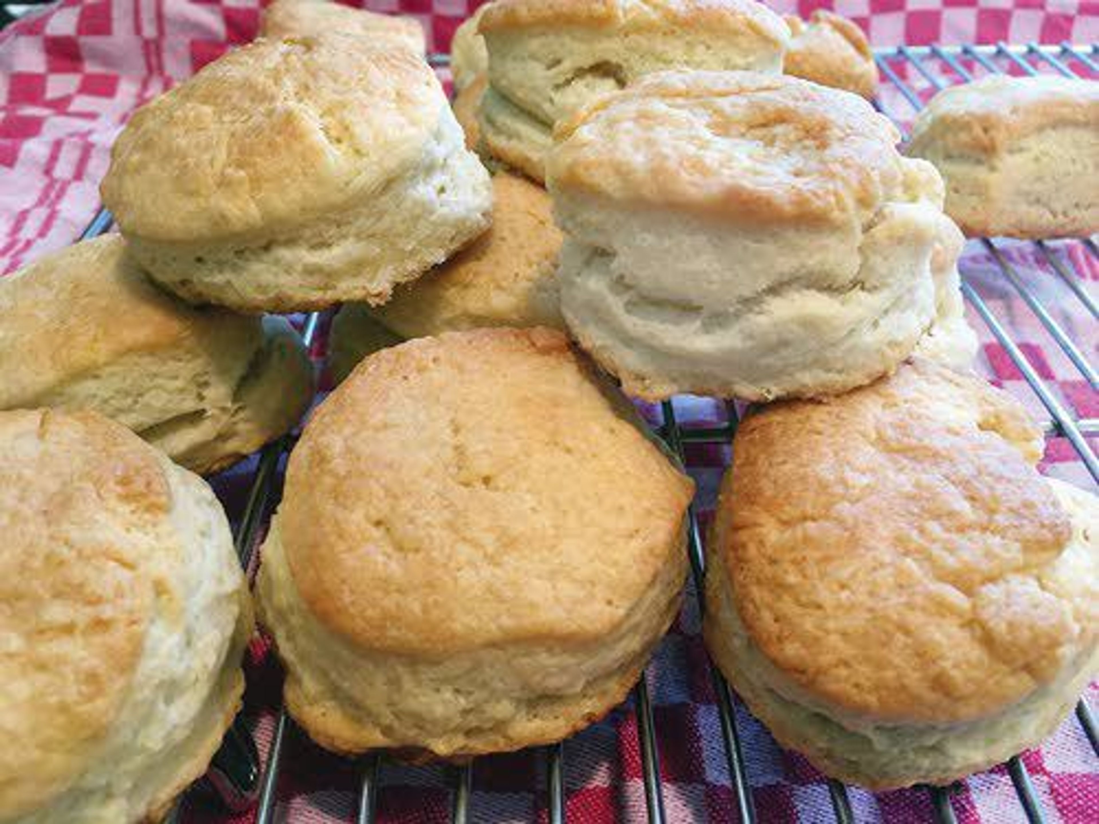 These three-ingredient biscuits use self-rising flour, lard and real buttermilk. Once the biscuits are cut and on the cookie sheet, the tops are brushed with melted butter before and after baking.