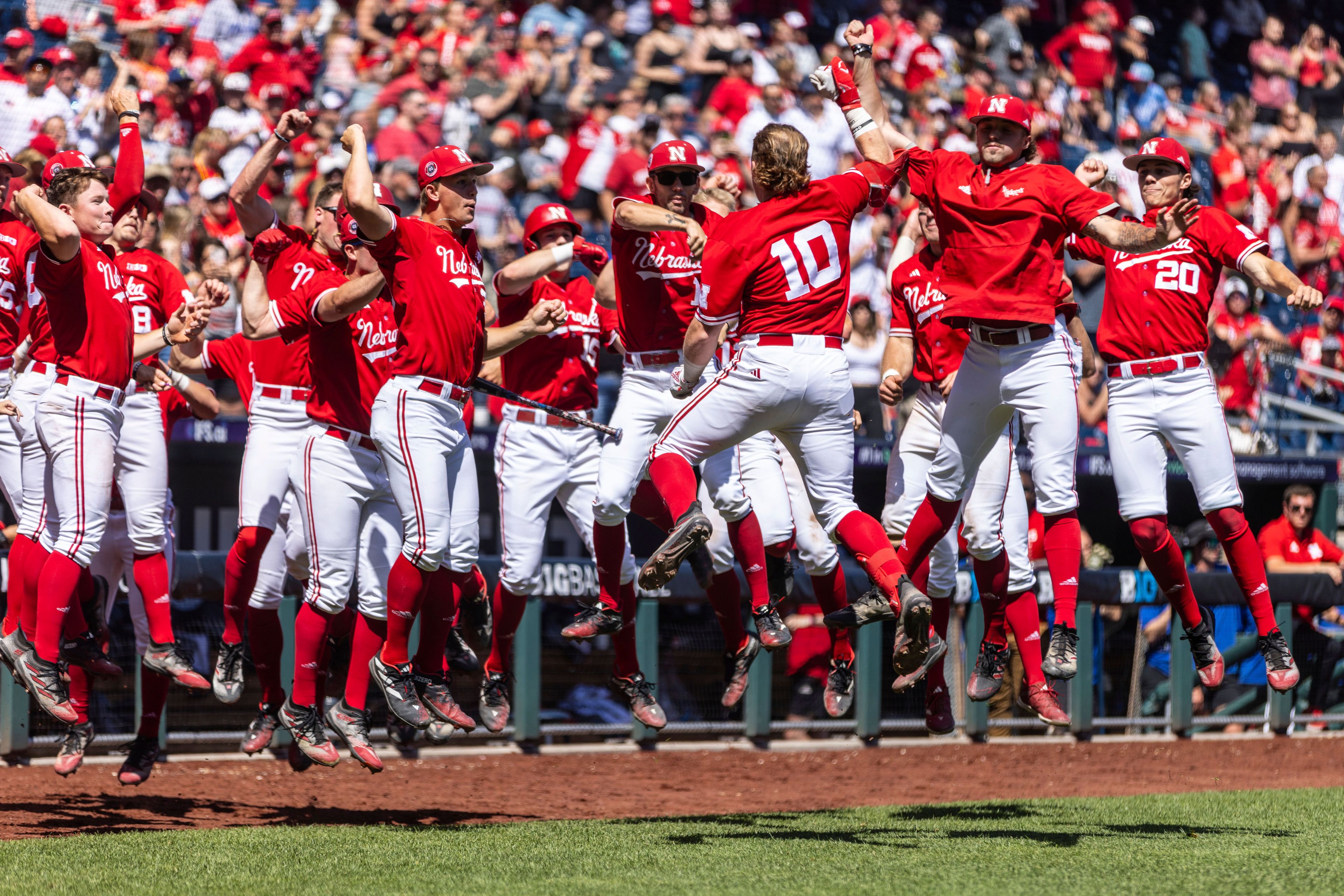 Nebraska players celebrate after a home run by teammate Ben Columbus (10) during the fifth inning of a game against Ohio State in the Big Ten NCAA college baseball tournament in Omaha, Neb., Friday, May 24, 2024.