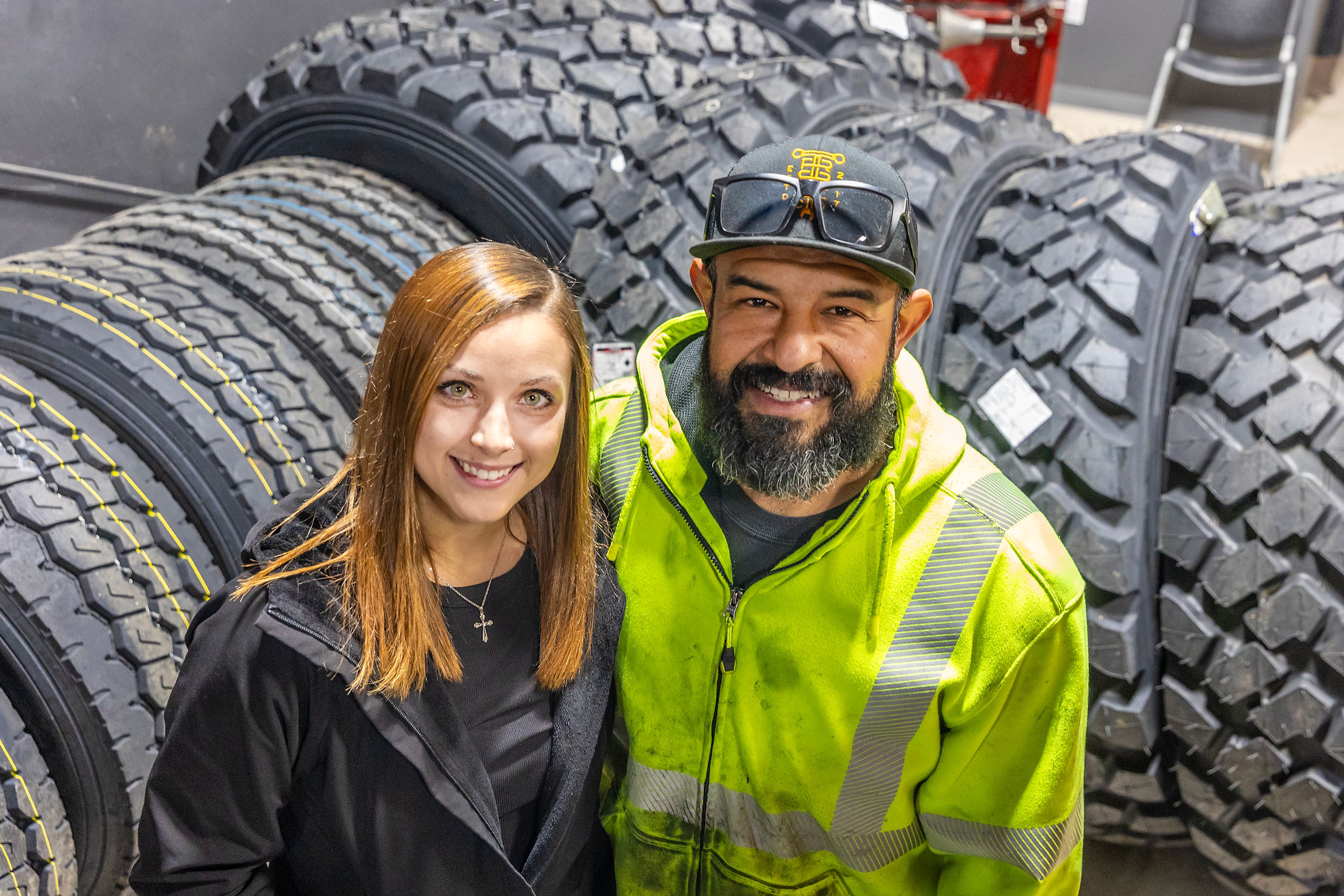 Meghan Garrett and Martin Flores pose for a photo inside Jackman Tire Thursday in the Lewiston Orchards.