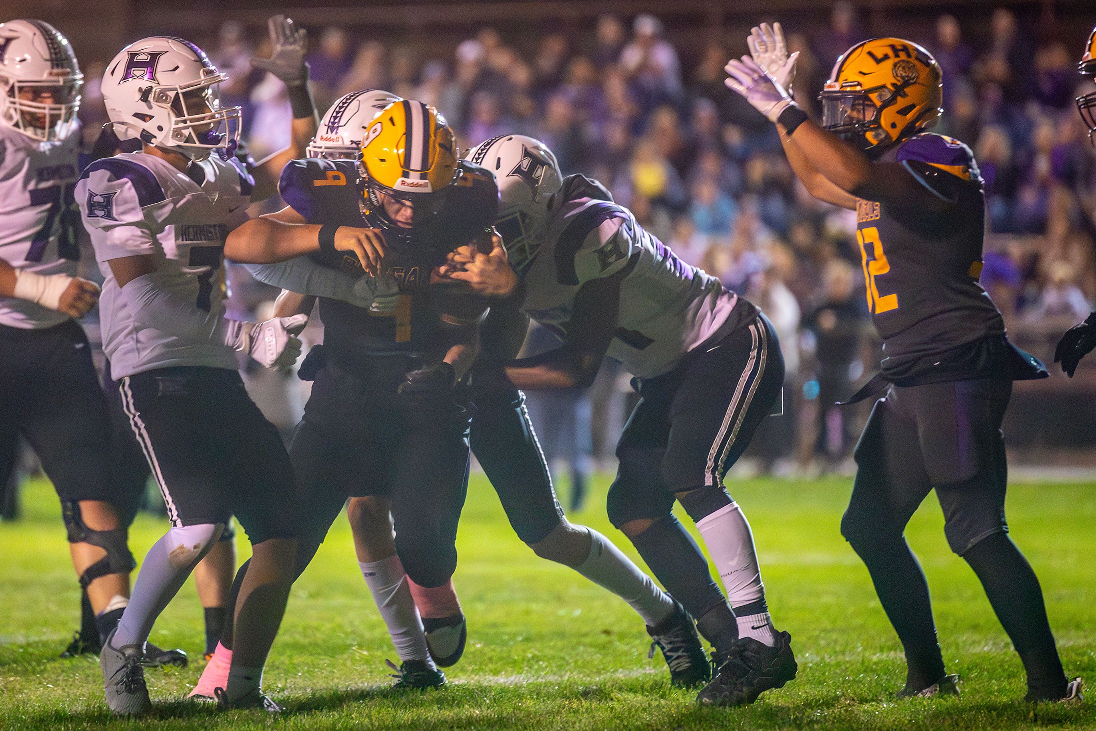 Lewiston quarterback Jeremy Yoder gets across the line for a touchdown against Hermiston during a nonconference game at Bengal Field Friday in Lewiston.,