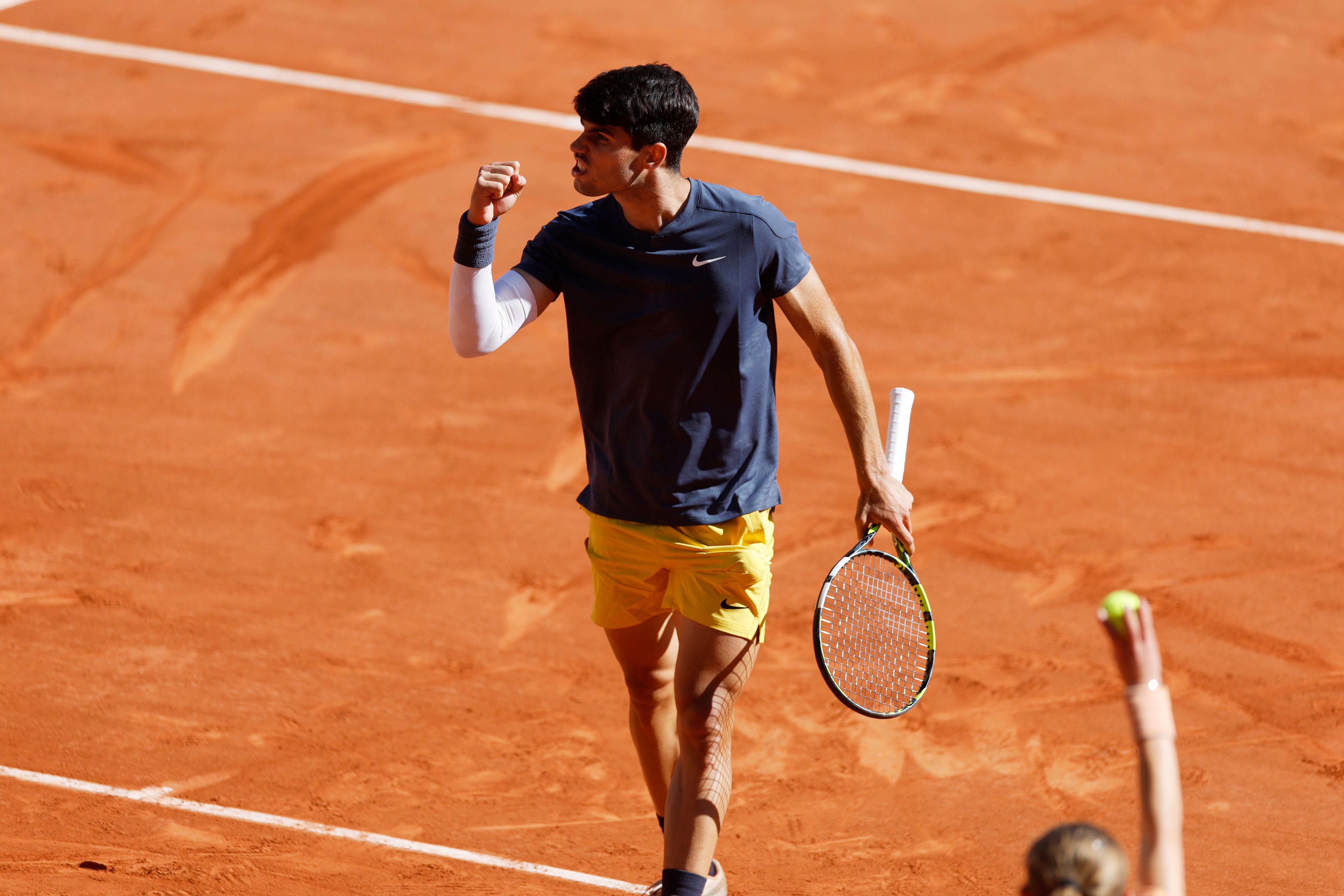 Spain's Carlos Alcaraz reacts during his semifinal match of the French Open tennis tournament against Italy's Jannik Sinner at the Roland Garros stadium in Paris, Friday, June 7, 2024.