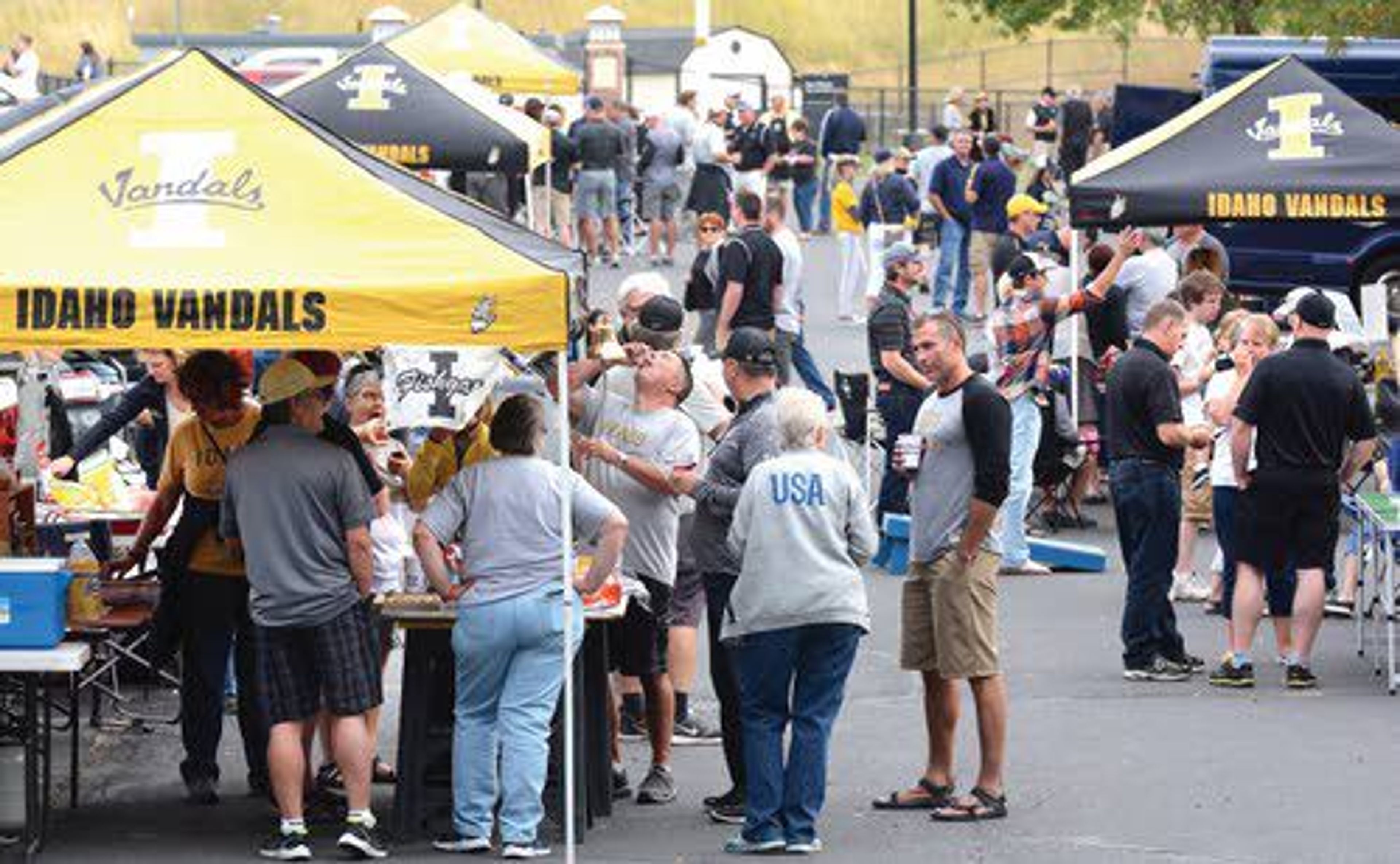 In this photo taken Thursday evening, Vandal fans enjoy tailgating festivities in the Kibbie Dome parking lot as the University of Idaho kicked off its football season with a game against Montana State in Moscow. Idaho won 20-17.