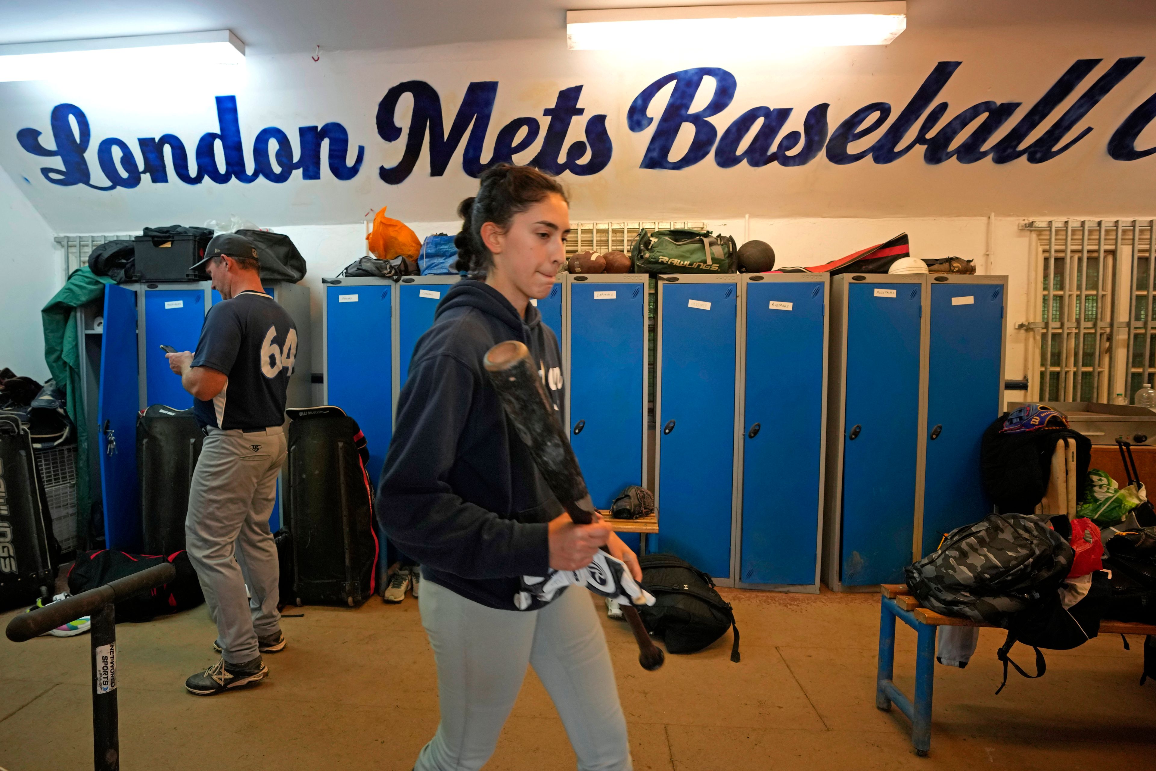 Players of the UK baseball team London Mets arrive clubhouse for a training session at the Finsbury Park in London, Thursday, May 16, 2024. Baseball at the highest club level in Britain is competitive. Teams are mélange of locals and expats some with college and minor league experience.