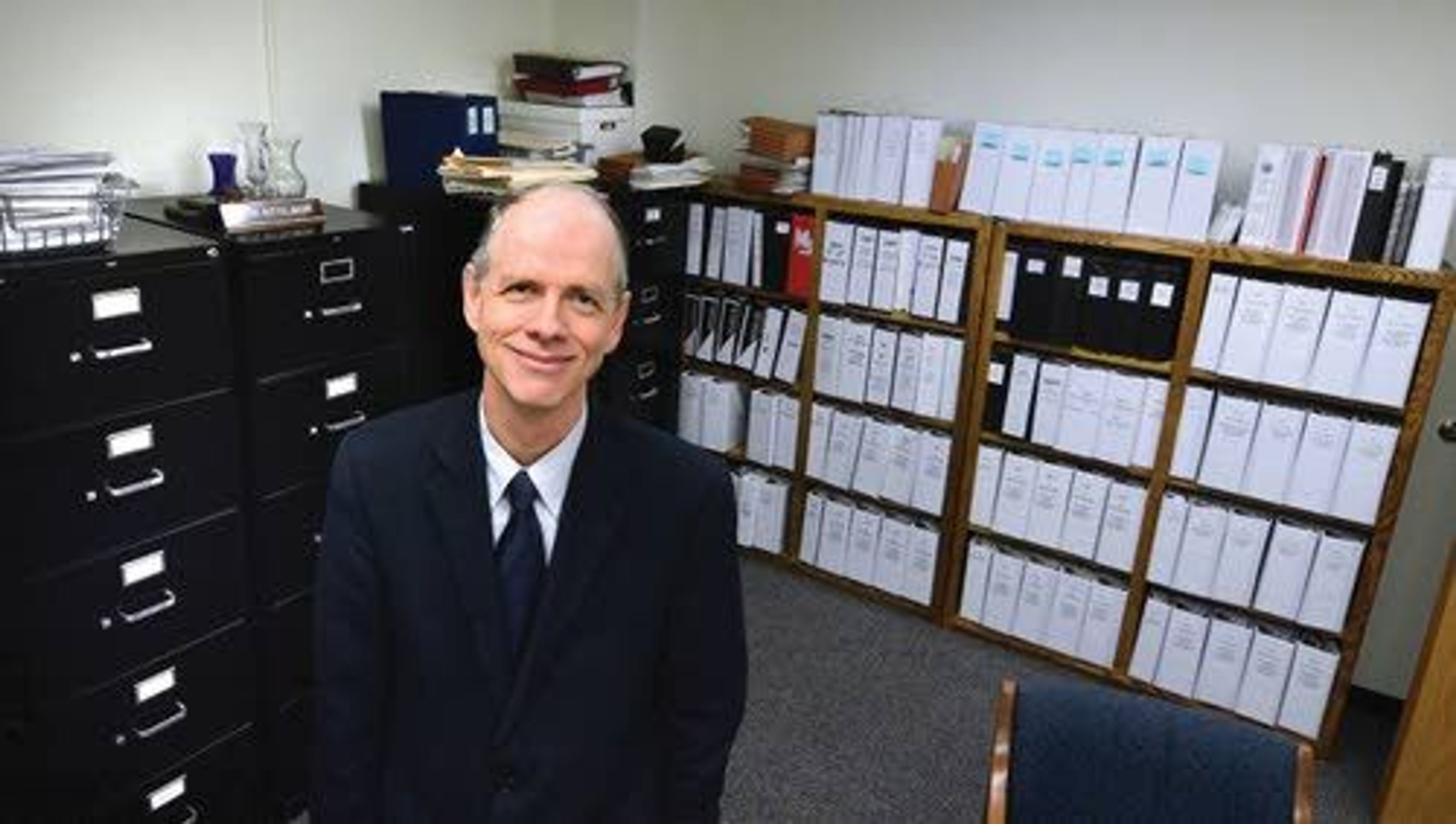 Brett DeLange, lead tobacco settlement attorney with the Idaho Attorney General’s Office, stands in the room where all the paper work is stored for the ongoing litigation with the tobacco industry.