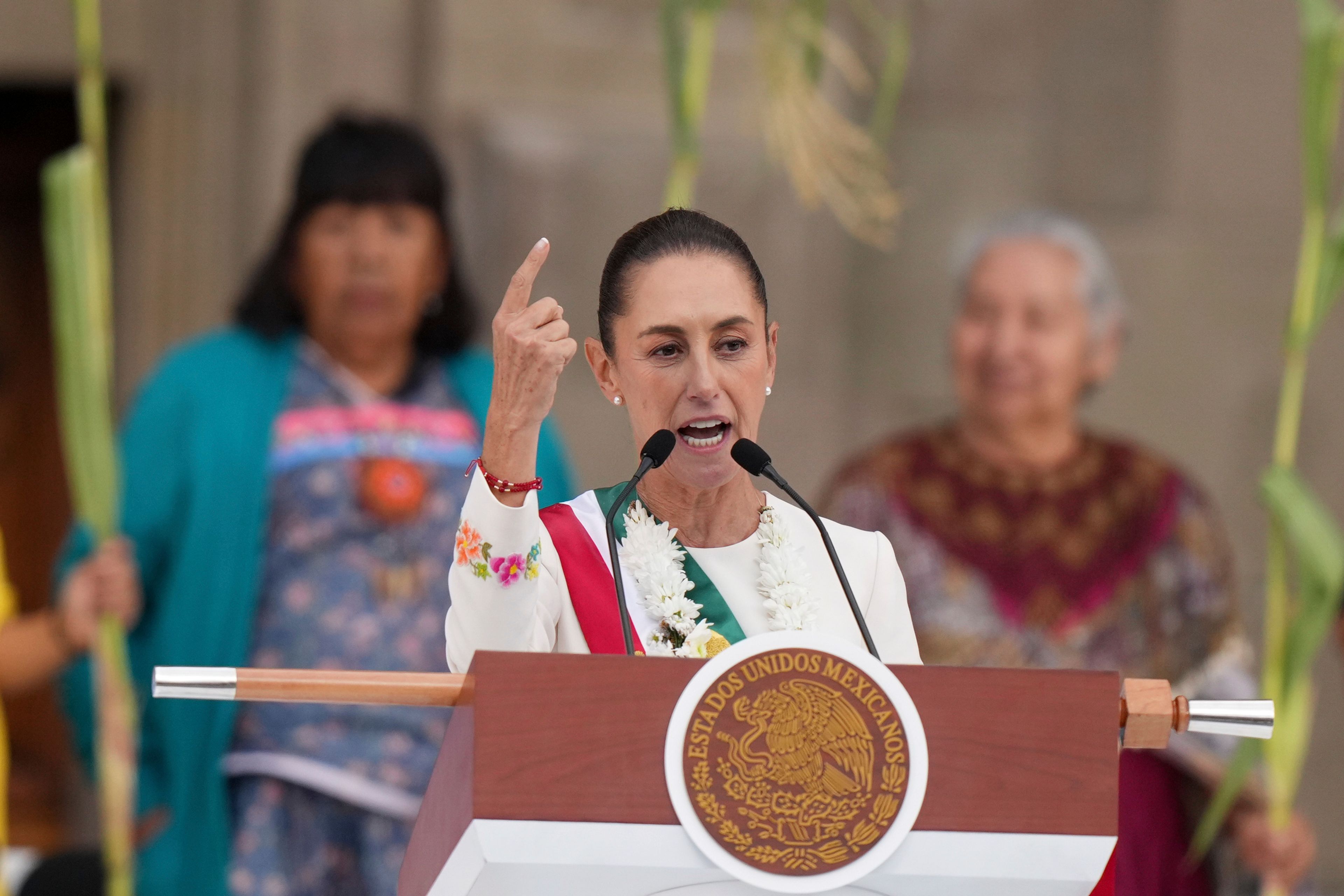 FILE - Newly-sworn in President Claudia Sheinbaum addresses supporters in the Zócalo, Mexico City's main square, on Oct. 1, 2024. (AP Photo/Fernando Llano, File)