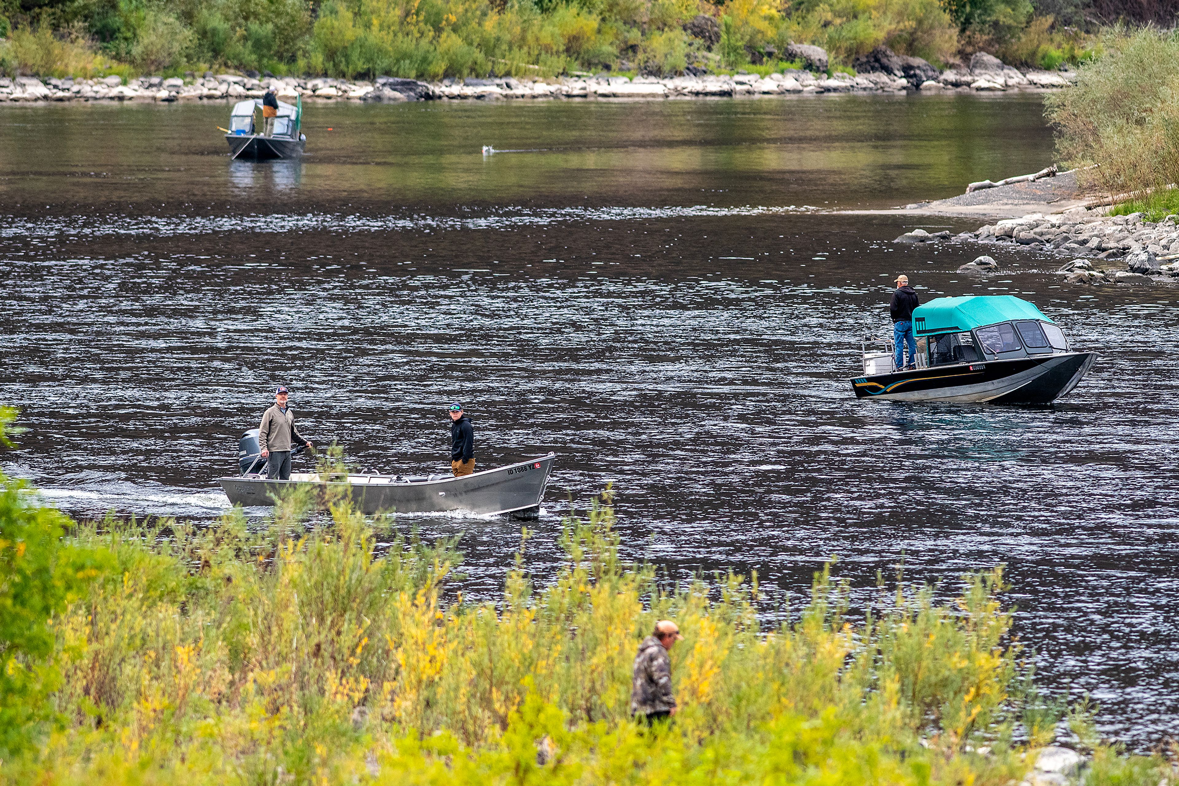 Fishermen float along the Clearwater River on Monday.,