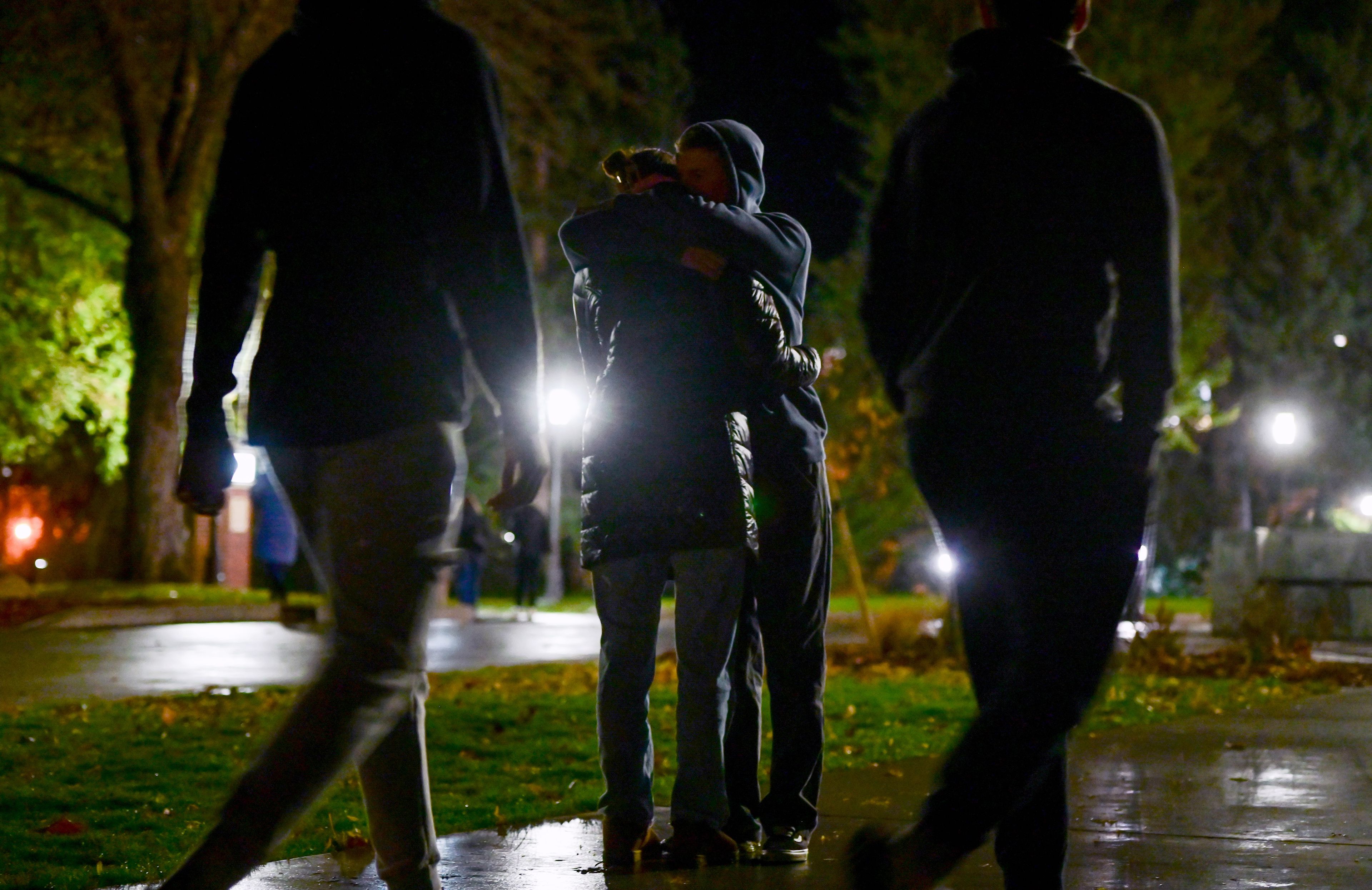 Two people stop to hug as the crowd departs from the vigil on Monday held in memory of the four University of Idaho students killed a year before in a quadruple homicide in Moscow.