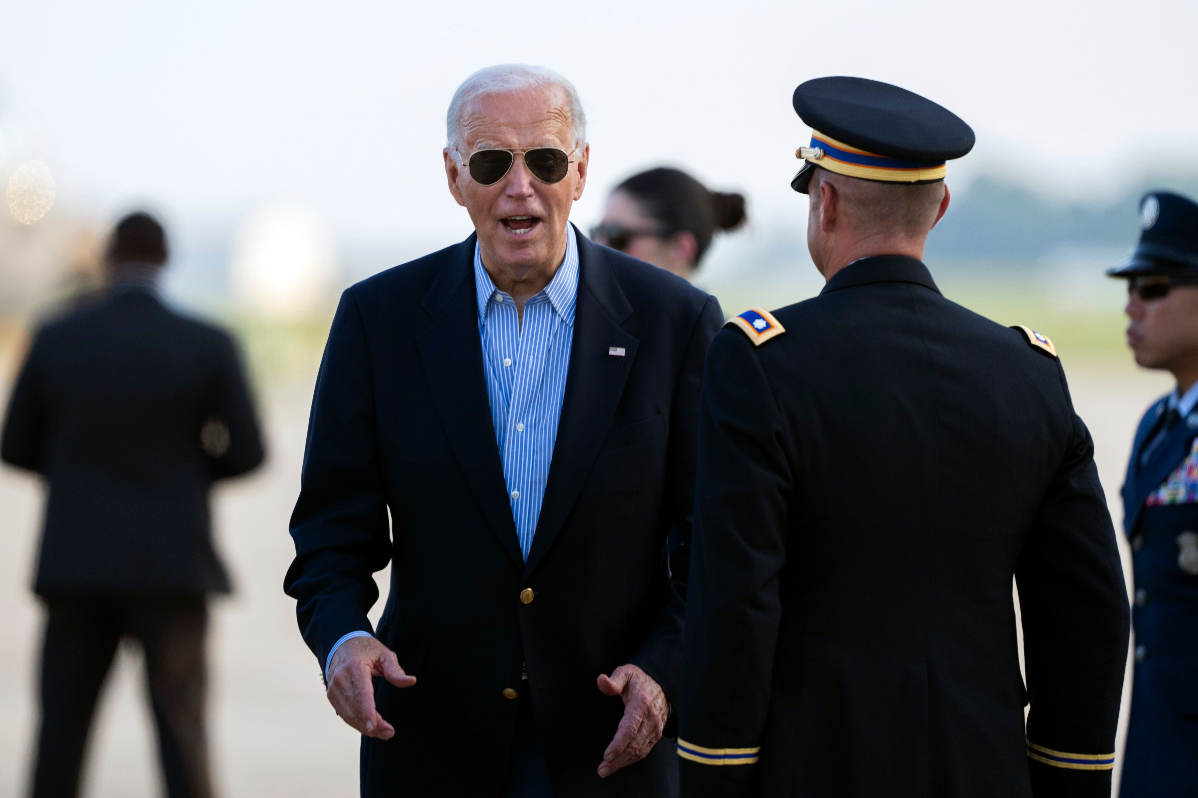 President Joe Biden responds to questions from the traveling press as he arrives at Delaware Air National Guard Base in New Castle, Del., Friday, July 5, 2024, from a campaign rally in Madison, Wis. (AP Photo/Manuel Balce Ceneta)