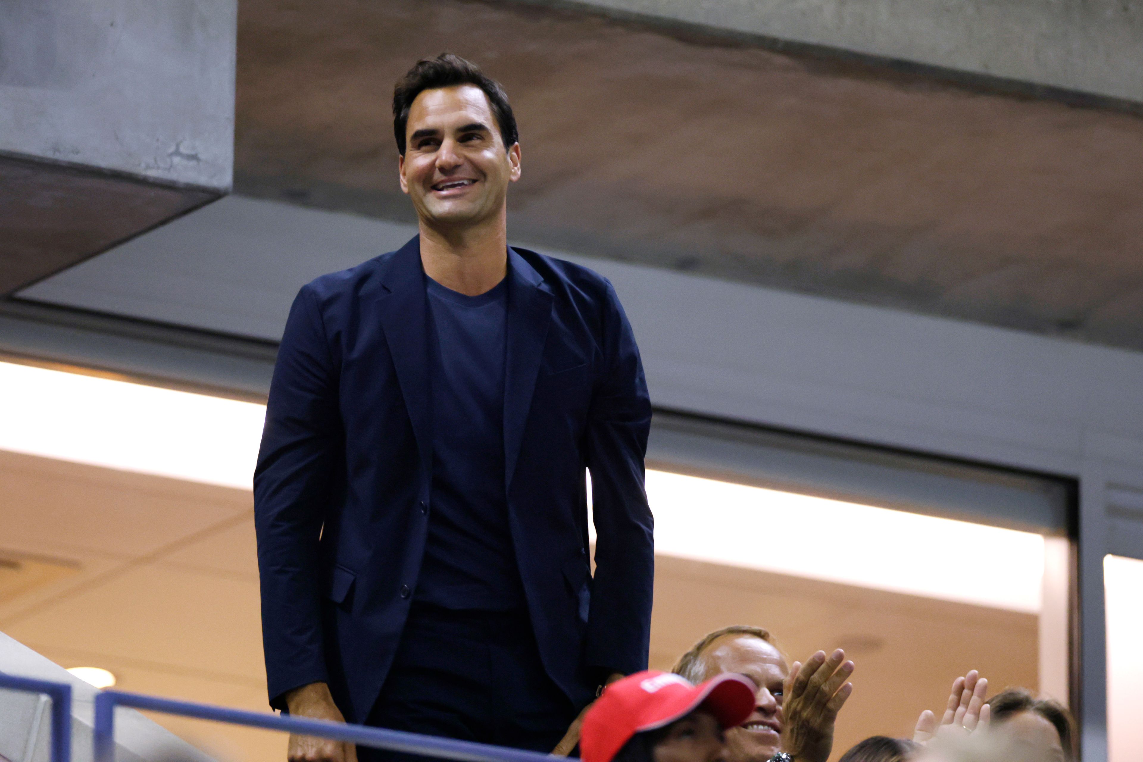 Tennis great Roger Federer acknowledges the crowd during the quarterfinal match between Aryna Sabalenka, of Belarus, and Zheng Qinwen, of China, during the U.S. Open tennis championships, Tuesday, Sept. 3, 2024, in New York.