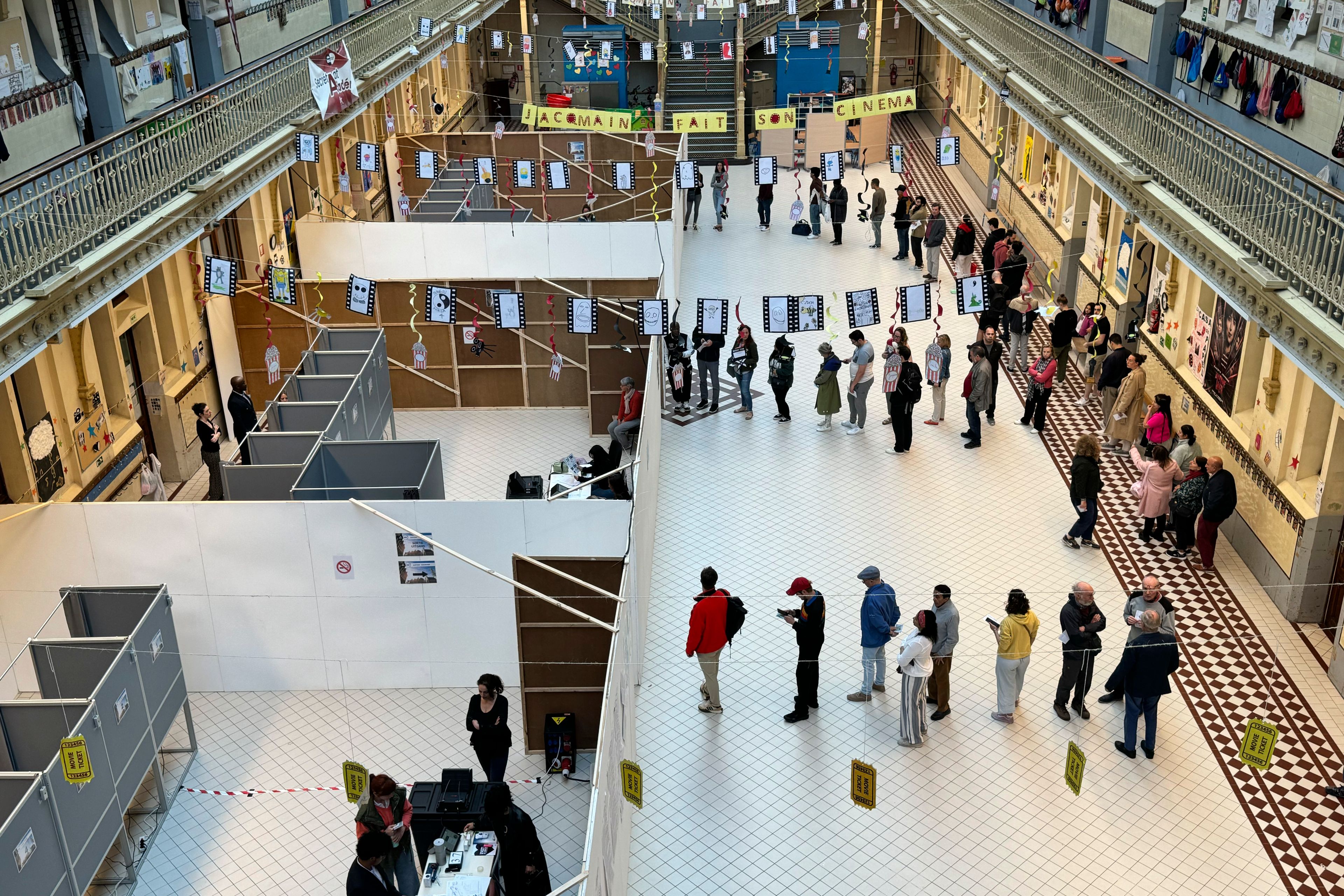 People line up to vote at a school in Brussels, Sunday, June 9, 2024. Polling stations opened across Europe on Sunday as voters from 20 countries cast ballots in elections that are expected to shift the European Union's parliament to the right and could reshape the future direction of the world's biggest trading bloc.