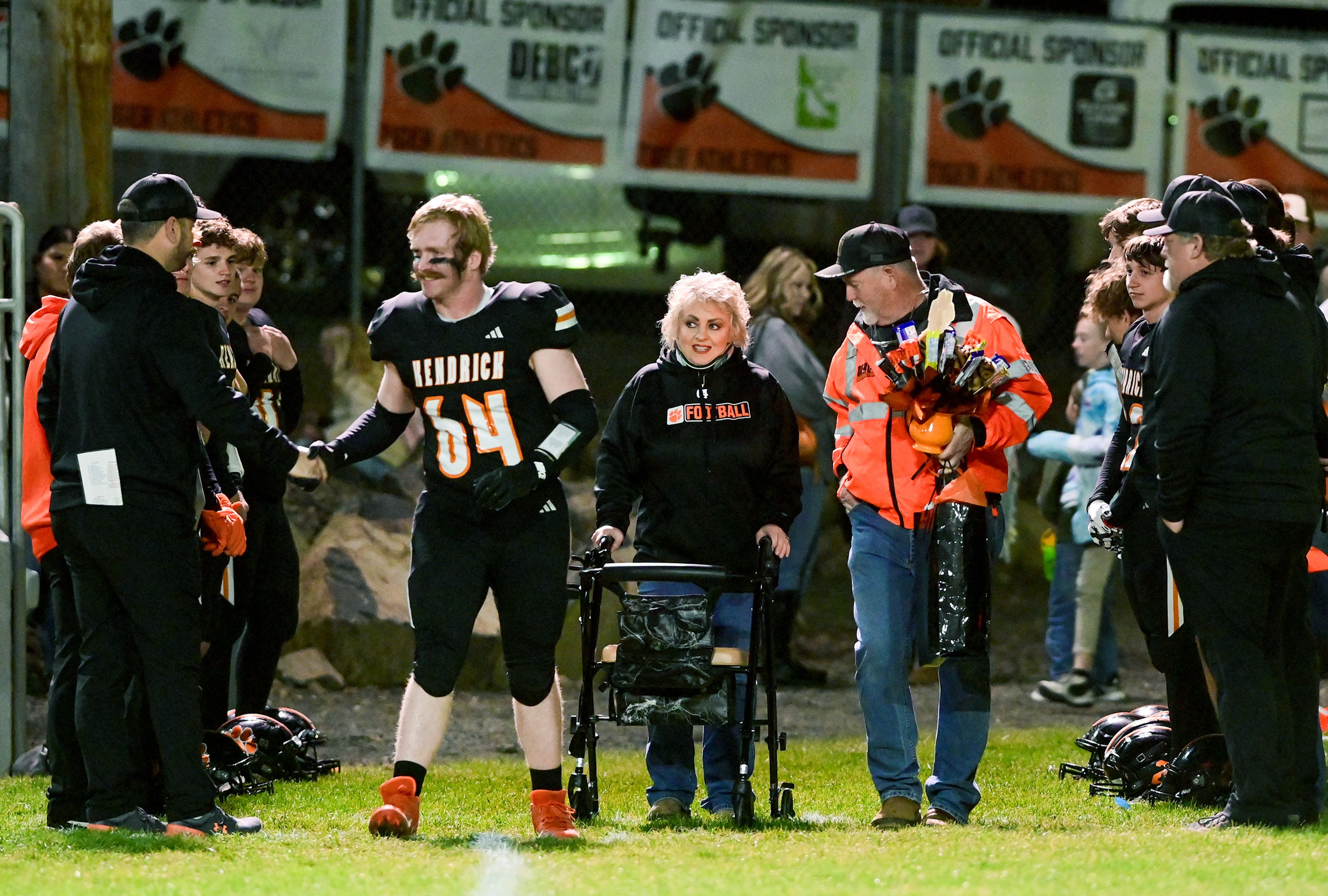 Kendrick senior Evan Simpson enters the field with family Friday for senior night recognition in Kendrick.,