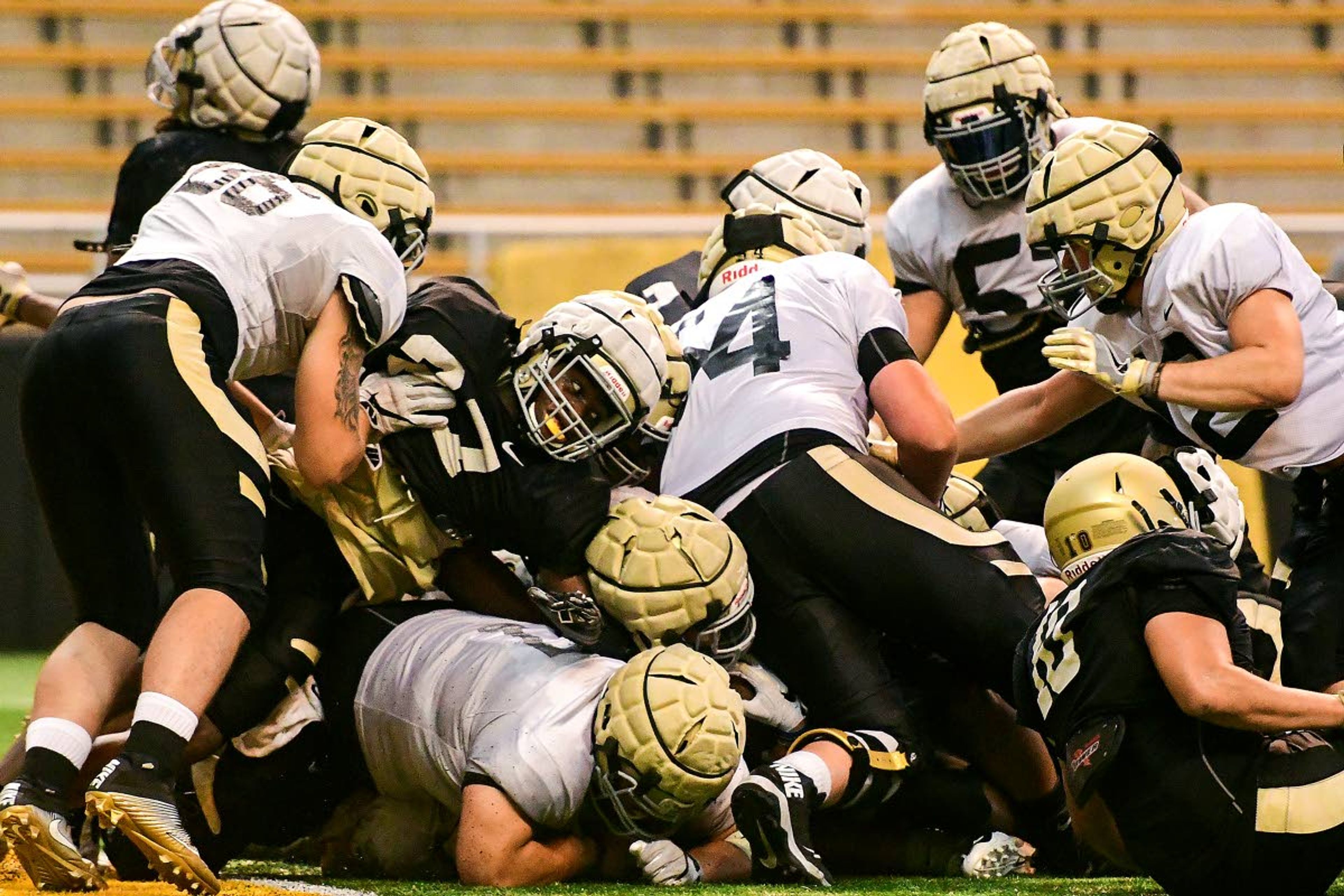 Tribune/Pete CasterSeveral Idaho offensive and defensive linemen pile on top each other after the Vandals’ defense stopped running back Roshaun Johnson on a fourth-and-goal attempt from the 2-yard line during an Aug. 10 scrimmage.